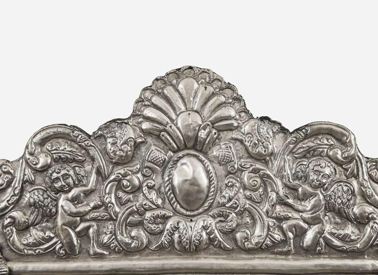 A Spanish Colonial style silver or silverplated repoussé mirror, 20th century