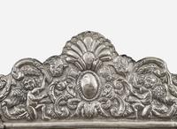 A Spanish Colonial style silver or silverplated repoussé mirror, 20th century