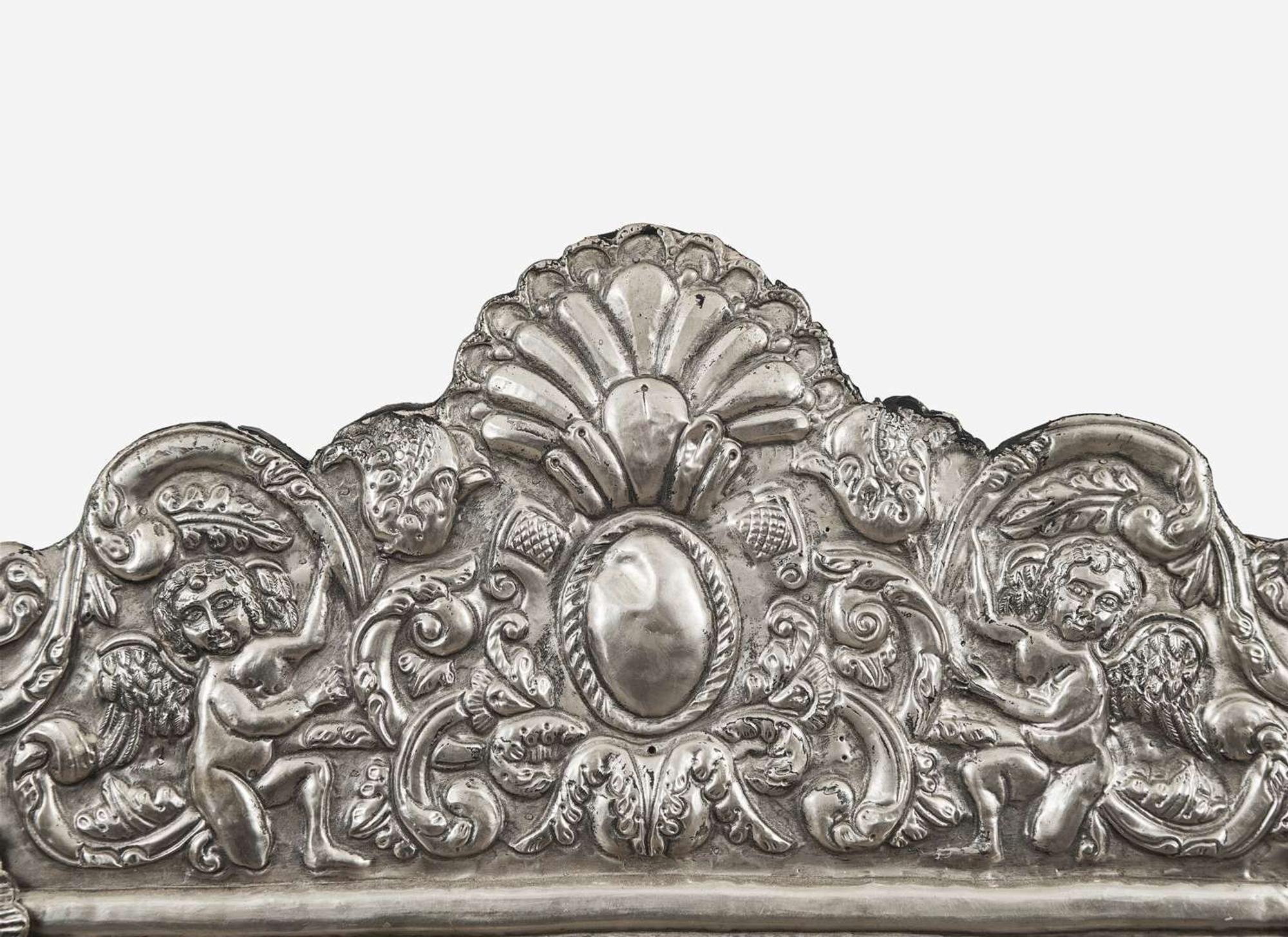 A Spanish Colonial style silver or silverplated repoussé mirror, 20th century