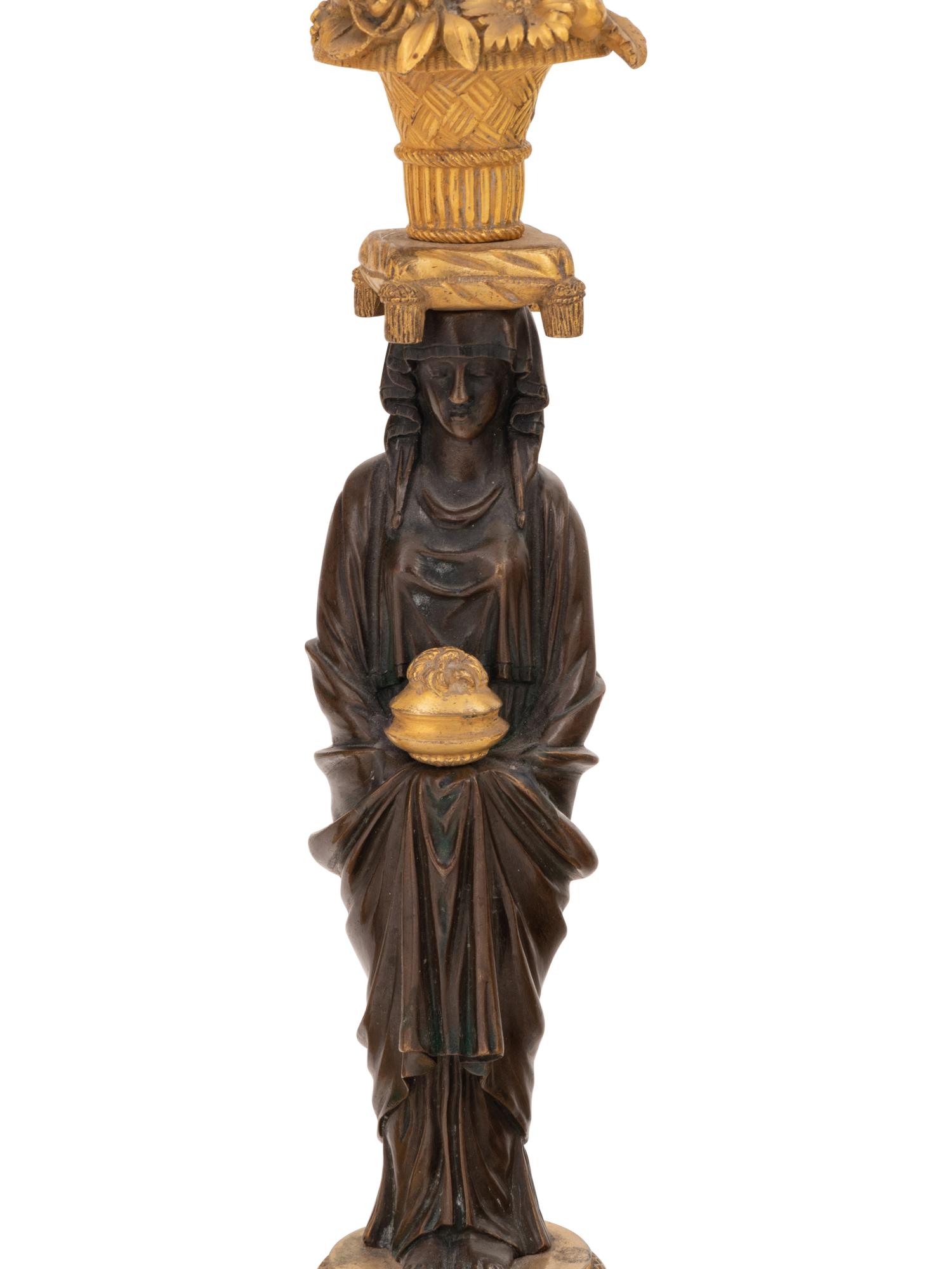 Two Pairs of French Gilt and Patinated Bronze Figural Candlesticks