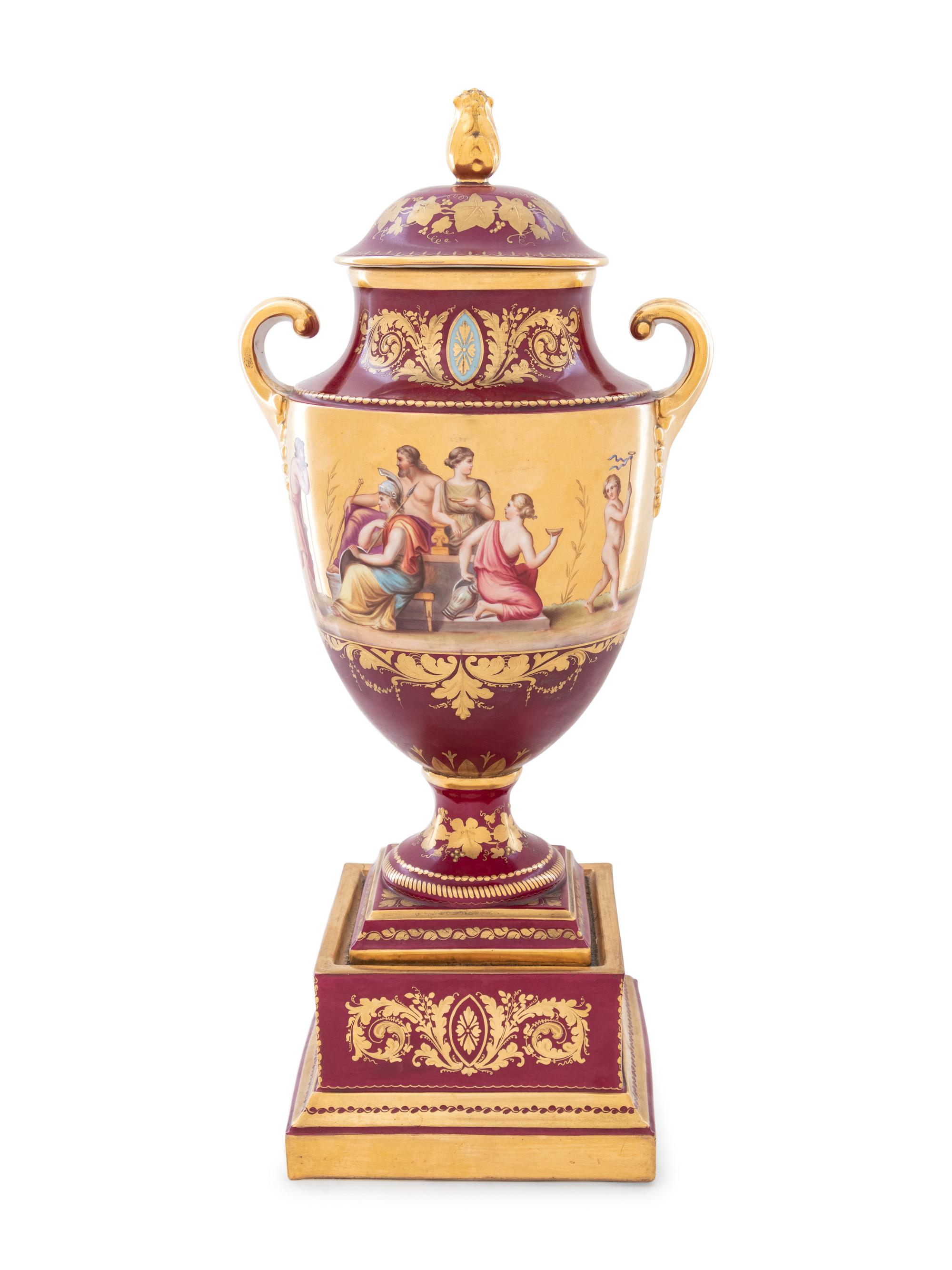 A Vienna Style Painted and Parcel Gilt Porcelain Covered Urn