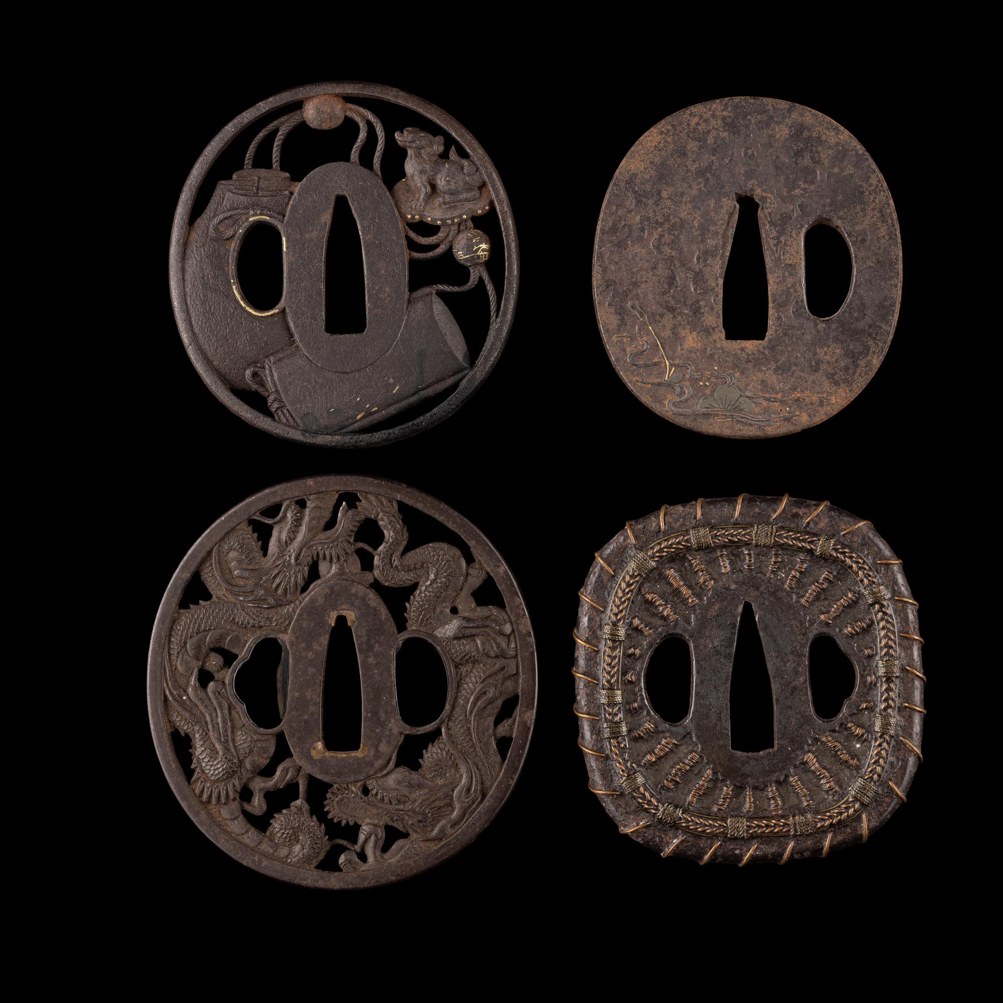 Four Japanese Inlaid Cast Iron Tsuba