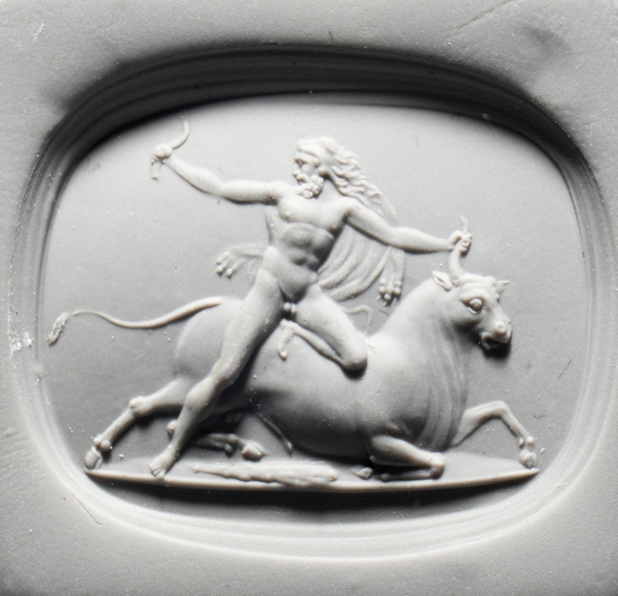 A Neoclassical Carnelian Intaglio with Hercules Battling Achelous