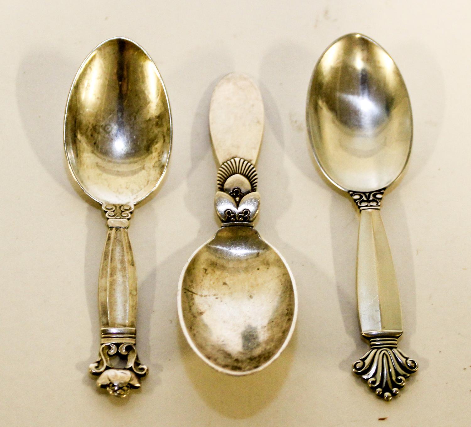 Three Danish Silver Child's Spoons, Georg Jensen Silversmithy, Copenhagen, comprising one example in the Cactus pattern, one example in