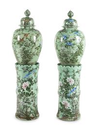 A Pair of Chinese Large Porcelain Covered Urns on Pedestals