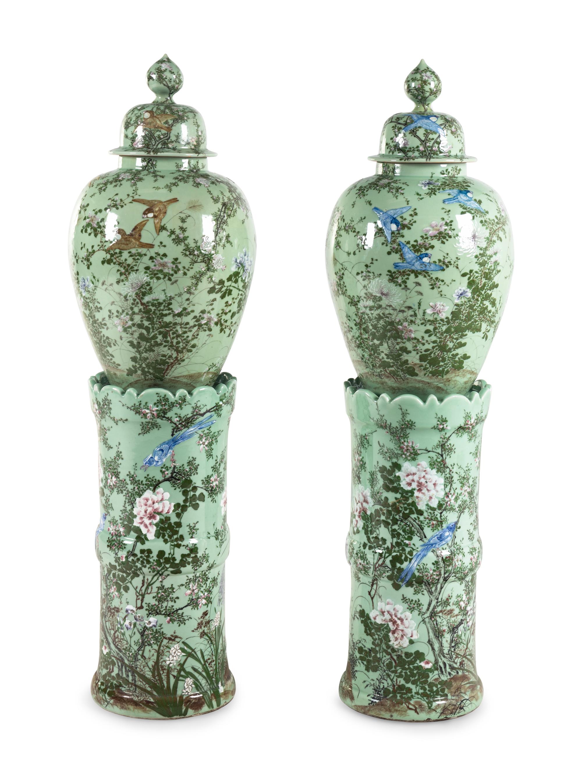 A Pair of Chinese Large Porcelain Covered Urns on Pedestals