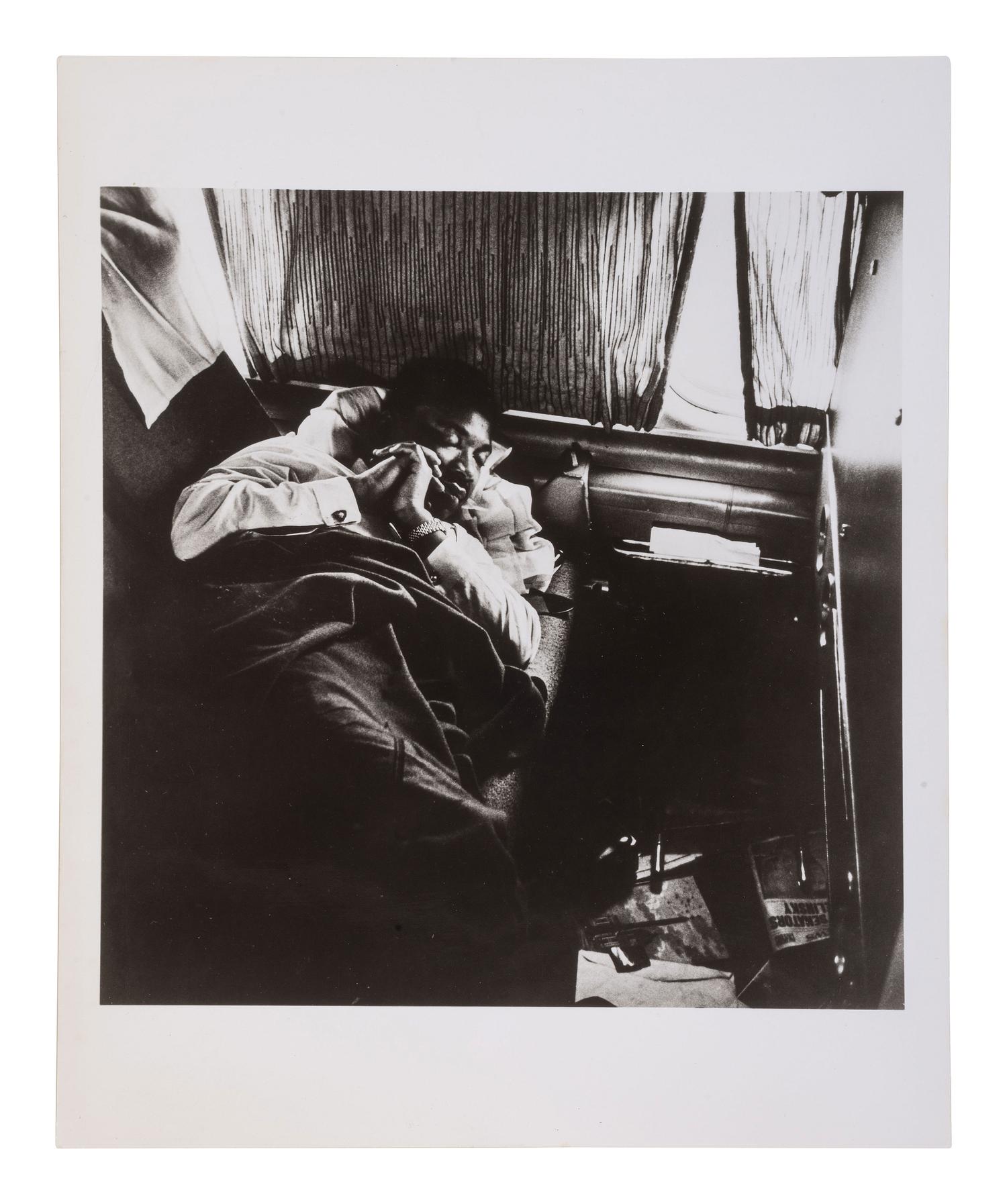 [KING, Martin Luther, Jr. (1929-1968)]. SLEET, Moneta, Jr. (1926-1996), photographer. Dr. King asleep on plane en route to Oslo, Norway to Receive Nobel Peace Prize, 1964 . Printed later.