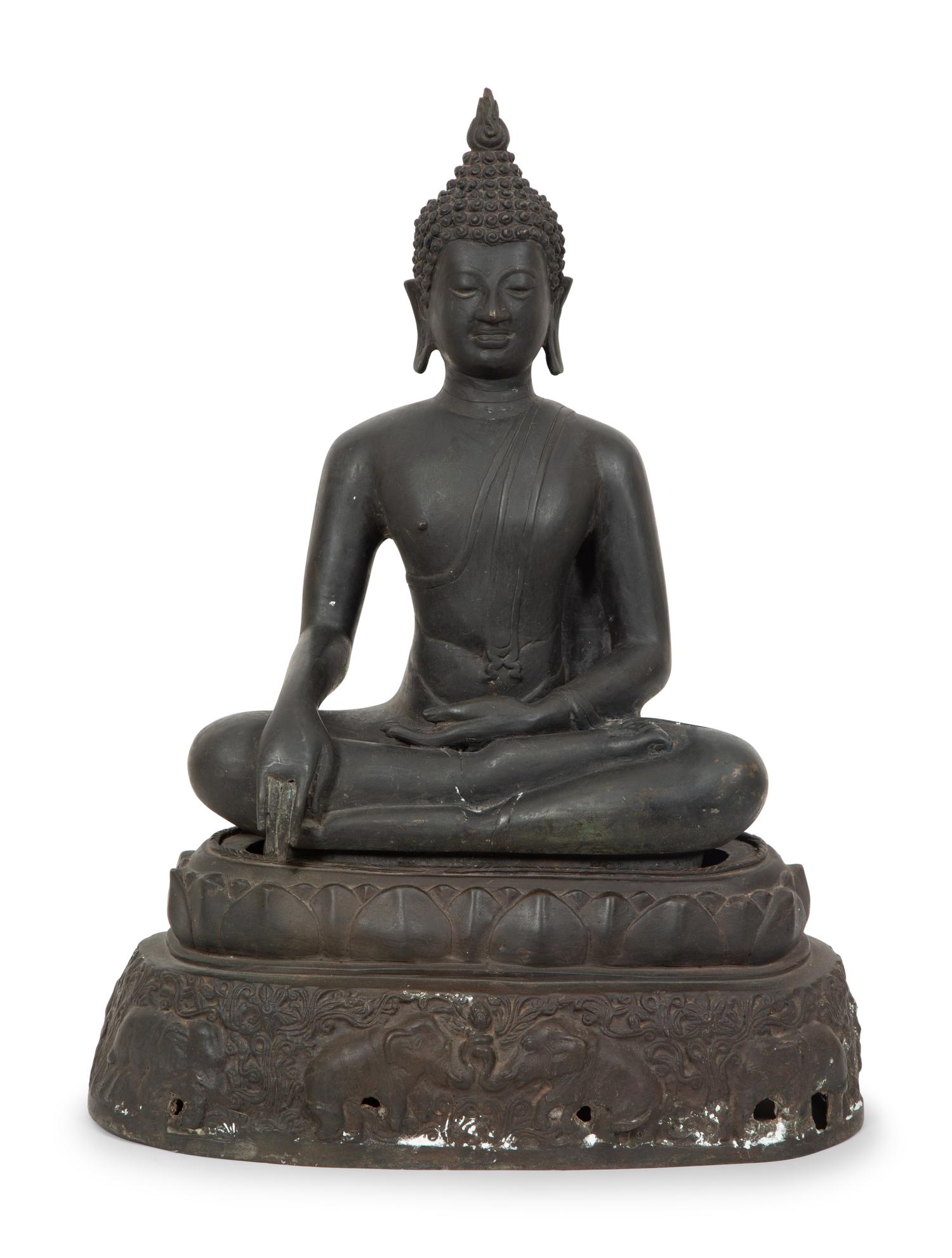 A Cambodian Bronze Figure of Seated Deity on Conforming Base