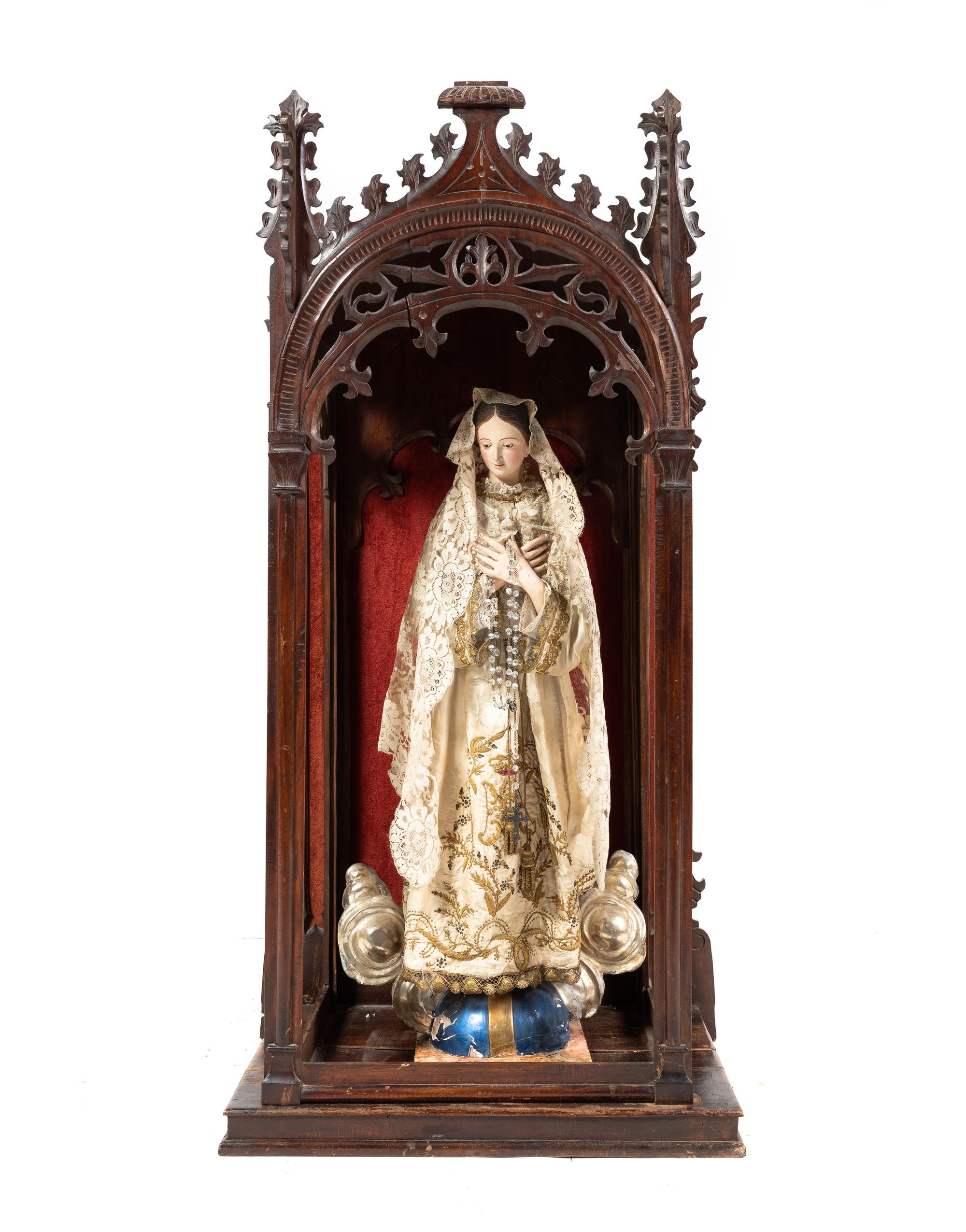 A Gothic Revival Mahogany Reliquary with a Continental Painted Figure of the Madonna