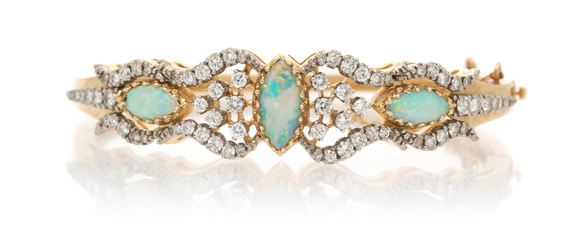 A 14 Karat Yellow Gold, Opal and Diamond Bangle Bracelet, 19.50 dwts.