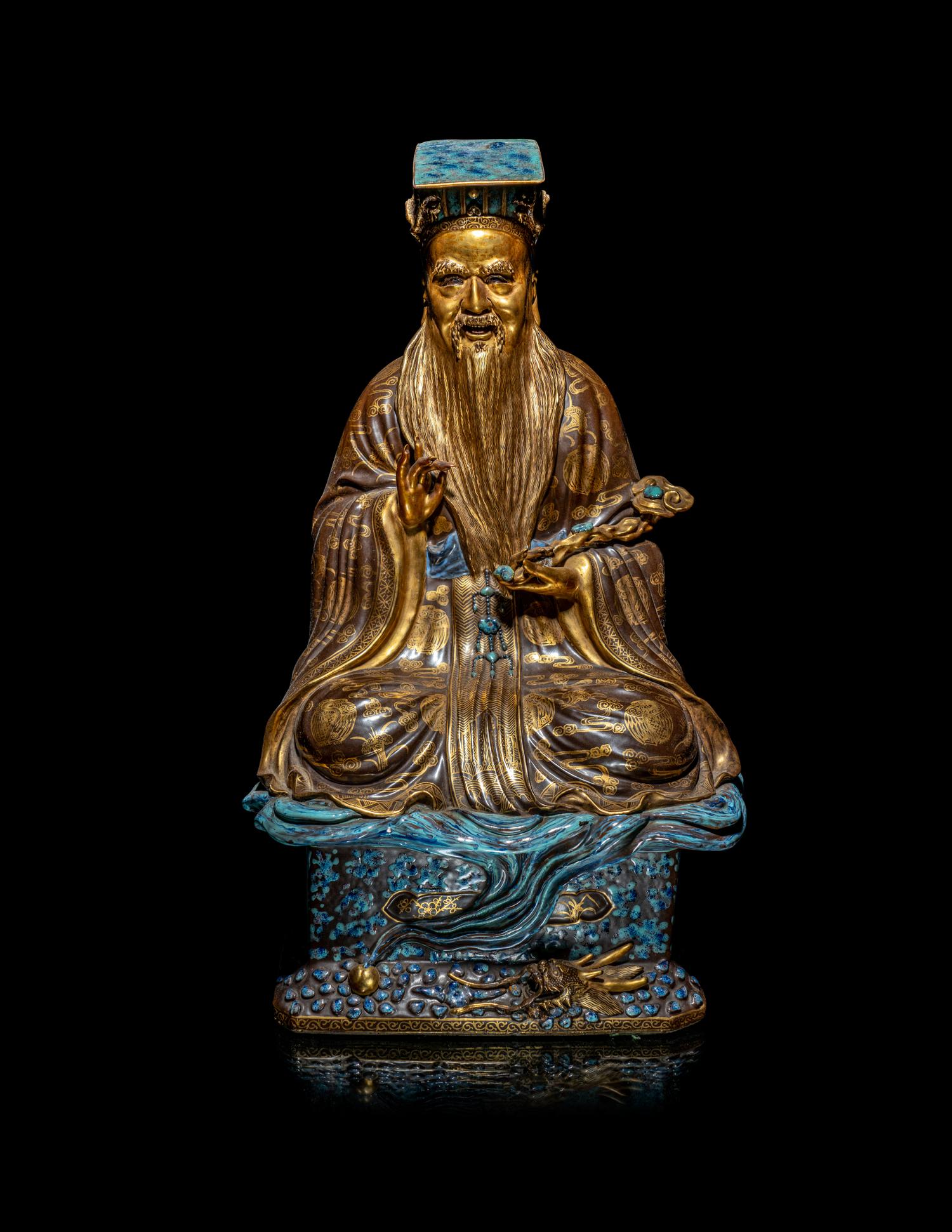 A Chinese Gilt Highlighted Robin's Egg Glazed Porcelain Figure of a Daoist Immortal