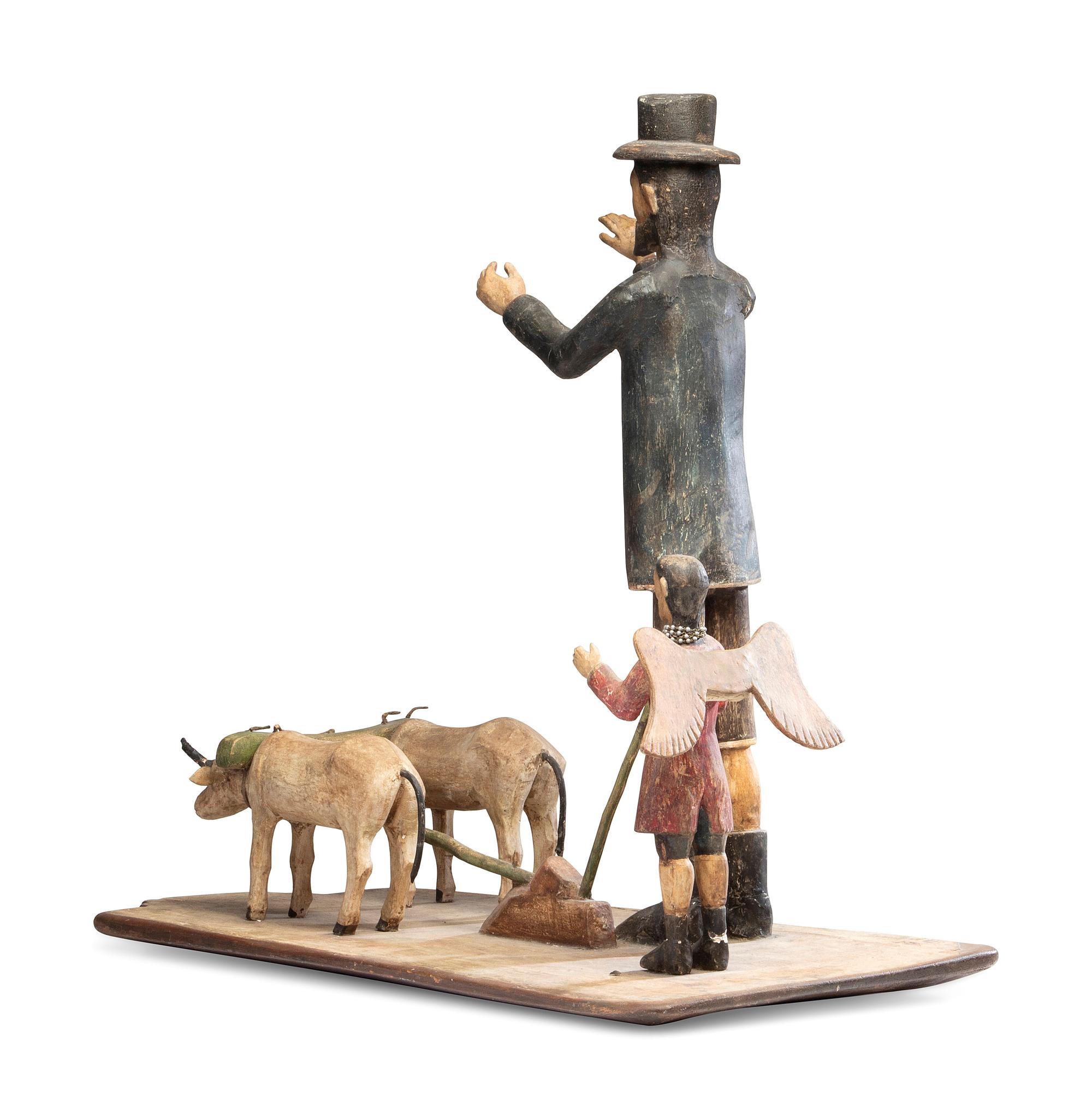 A Carved and Painted New Mexican Bulto of Saint Isidore