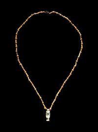 An Egyptian Bead and Faience Necklace with Khnum