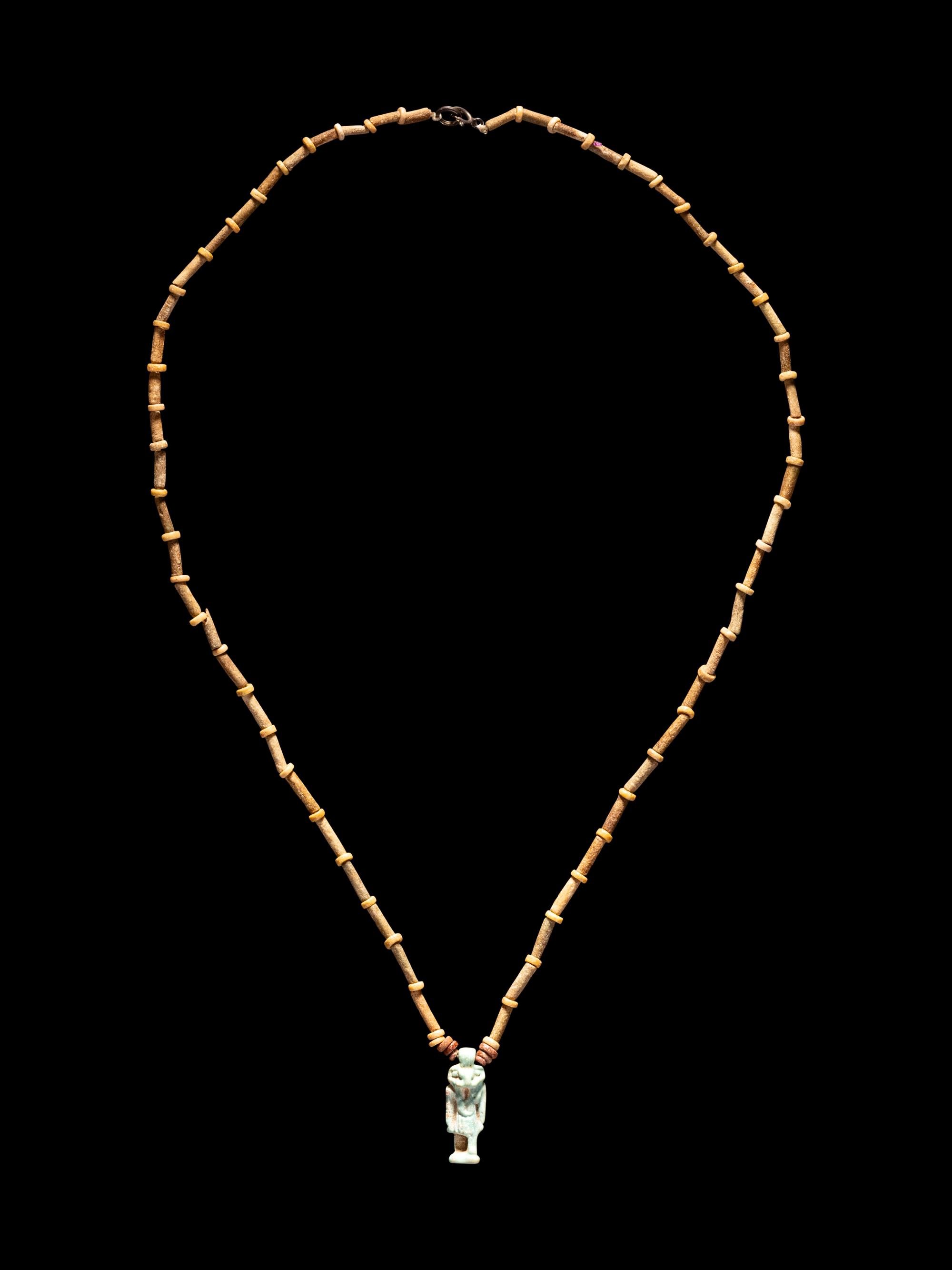An Egyptian Bead and Faience Necklace with Khnum