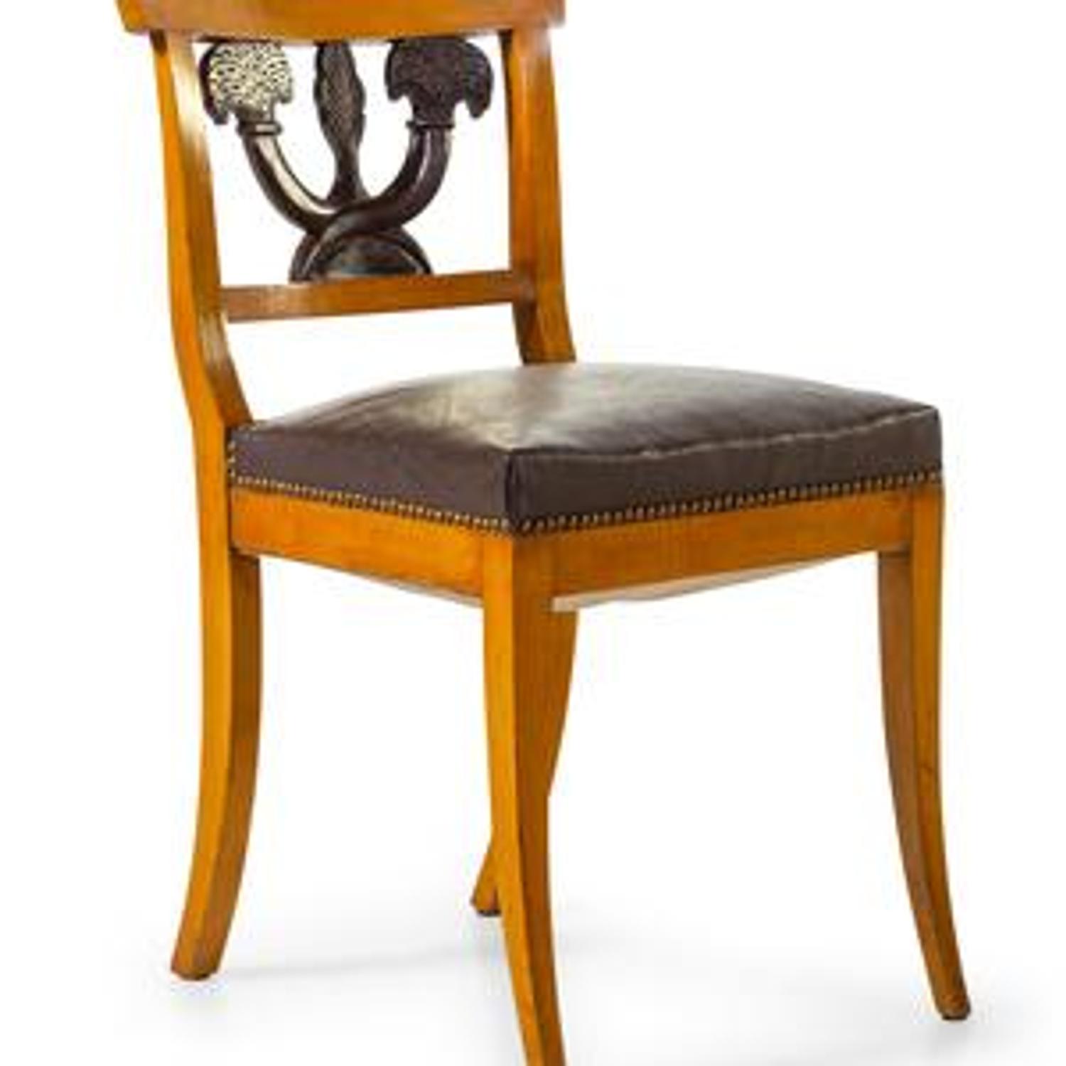 A Set of Twelve Biedermeier Style Parcel Ebonized Birch Dining Chairs