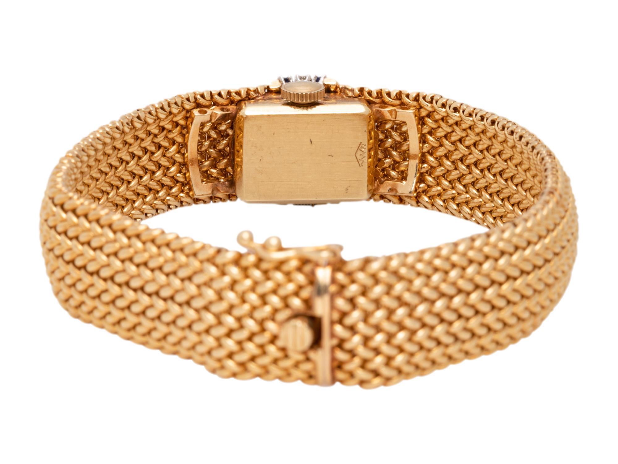 MOVADO, 14K YELLOW GOLD, DIAMOND AND SAPPHIRE SURPRISE WRISTWATCH