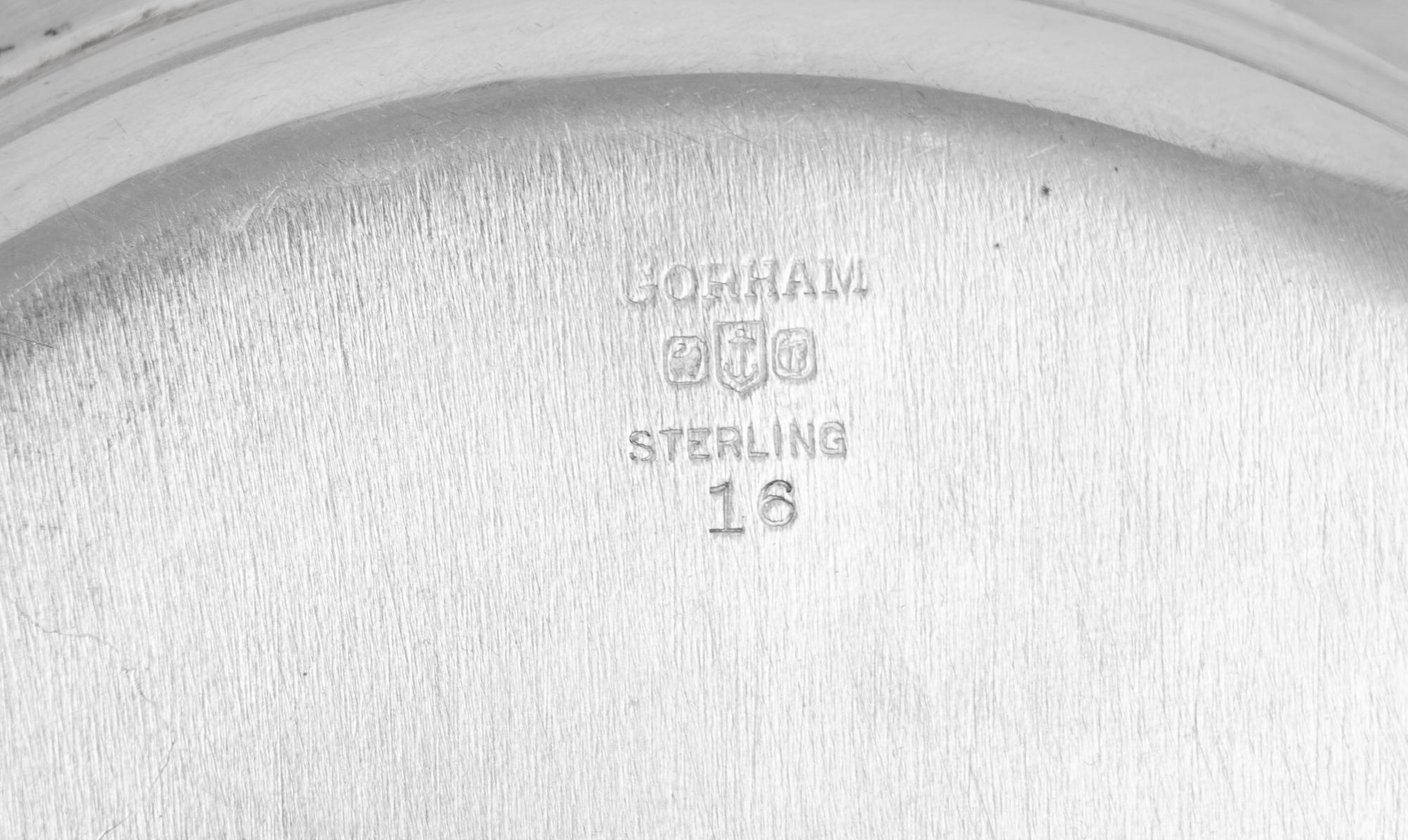 A Set of Eleven American Silver Bread Plates