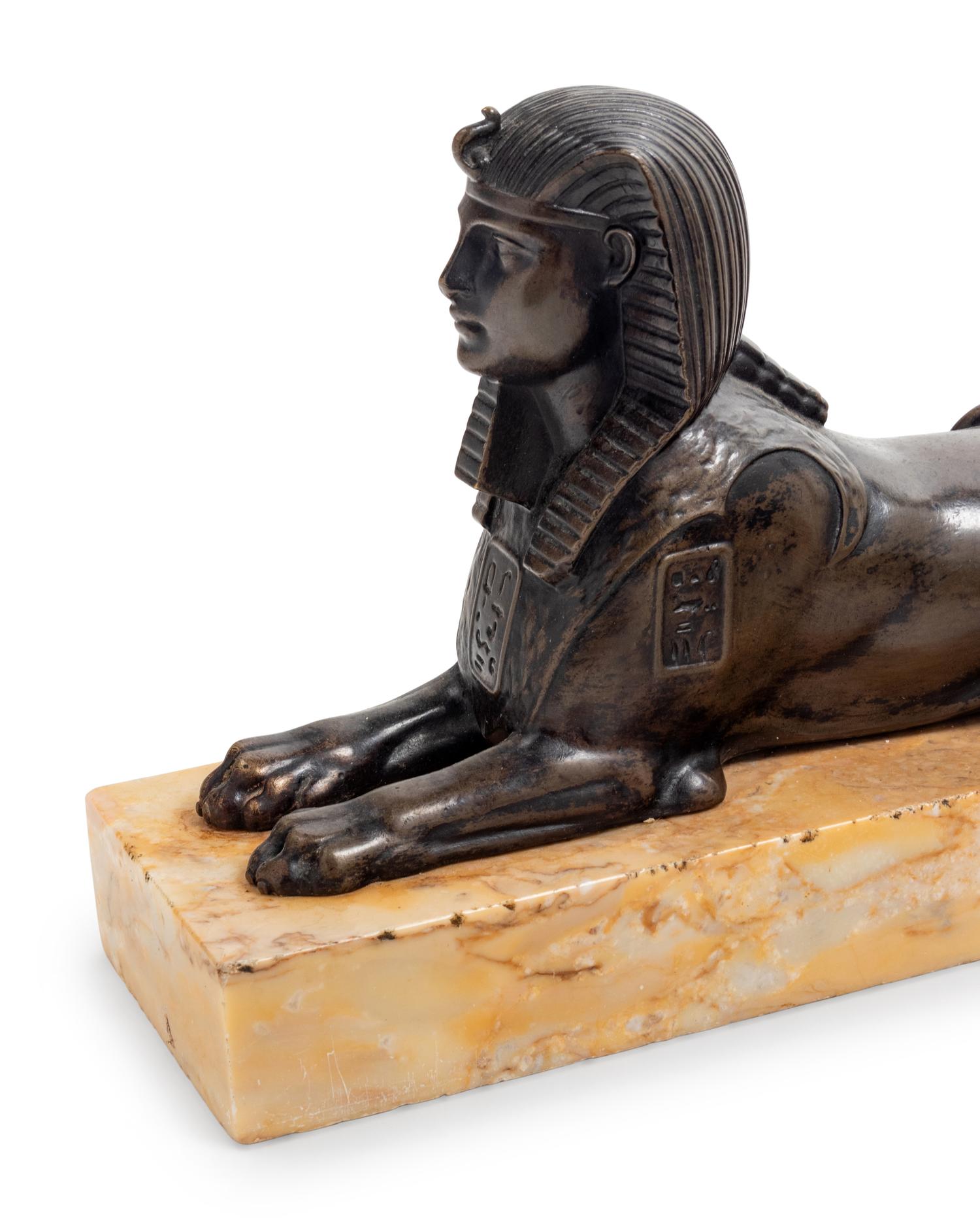 A Pair of Empire Style Cast Bronze Sphinx-Form Bookends