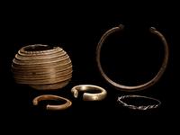Five African Metalwork Currency Bracelets