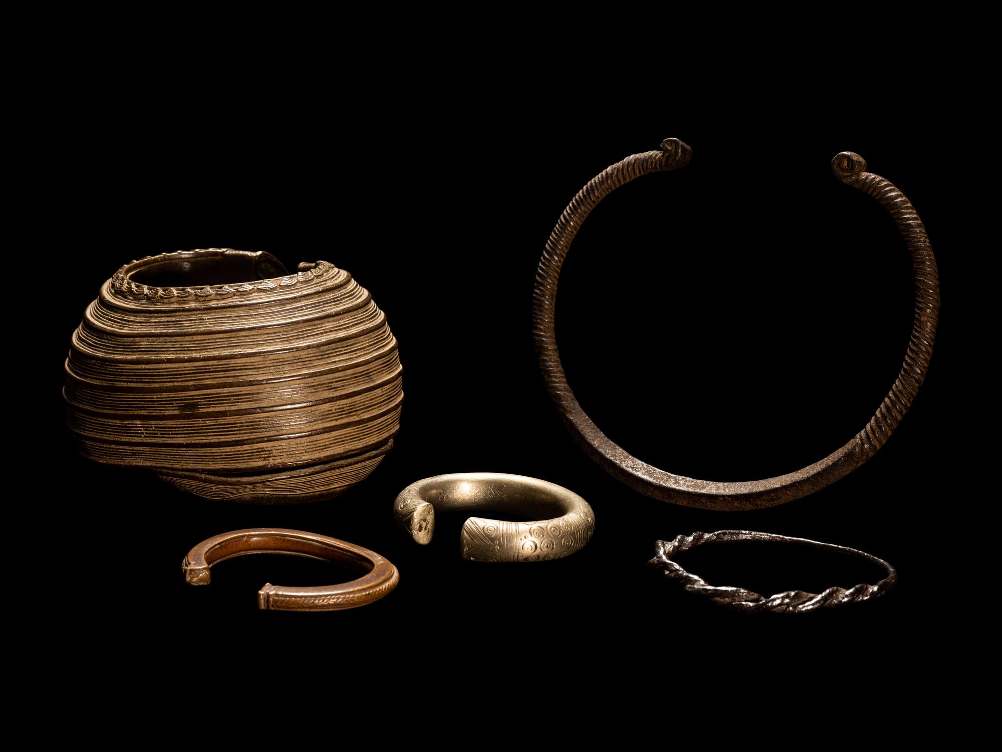 Five African Metalwork Currency Bracelets