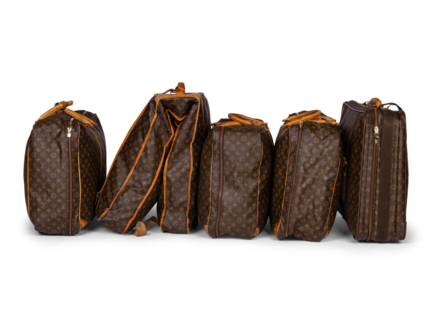 A Group of Five Louis Vuitton Travel Articles