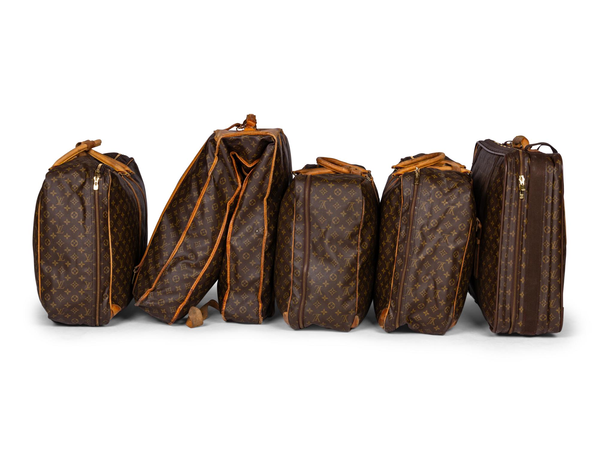 A Group of Five Louis Vuitton Travel Articles