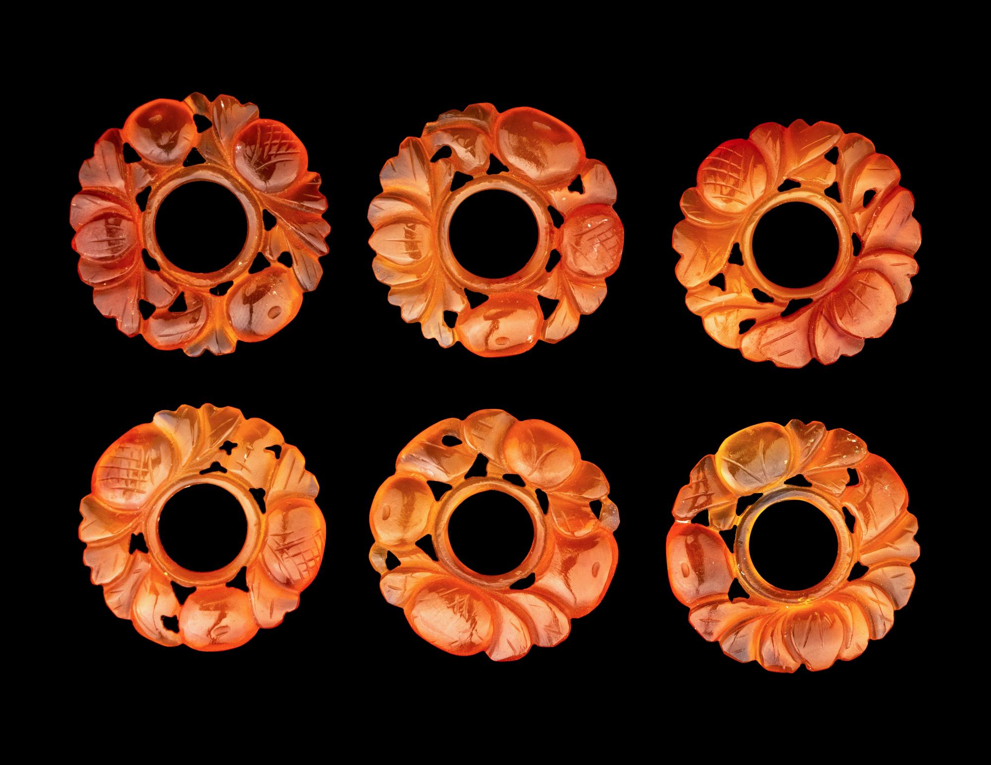 A Group of Chinese Red Carnelian and Coral Pendants