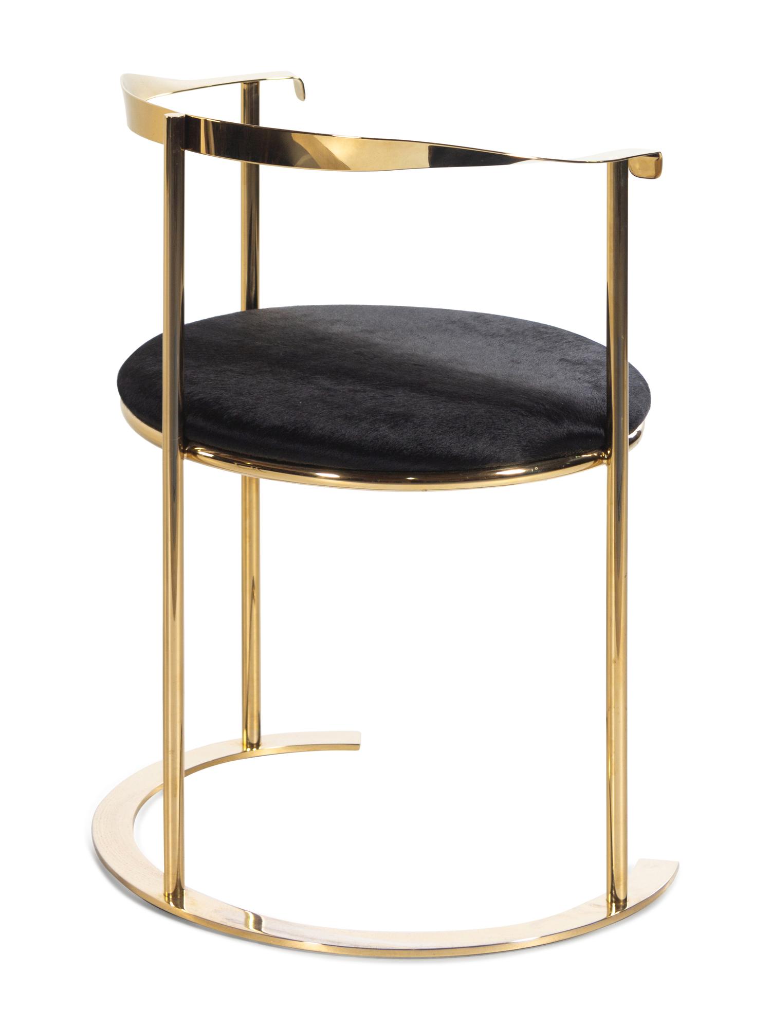 A Contemporary Brass and Haircalf Chair and a Contemporary Petrified Wood and Steel Side Table