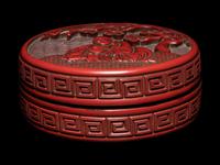 A Carved Cinnabar Lacquer 'Luohan' Circular Covered Box