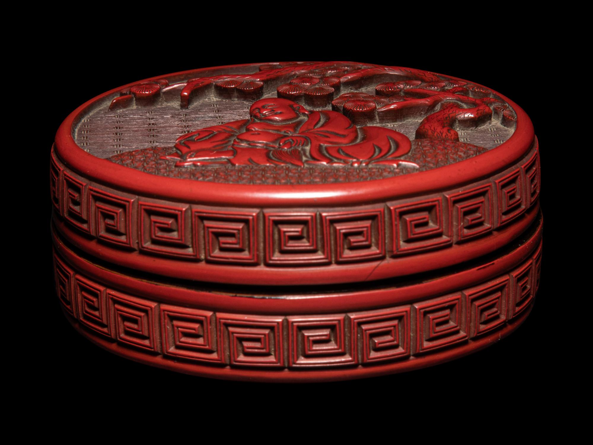 A Carved Cinnabar Lacquer 'Luohan' Circular Covered Box