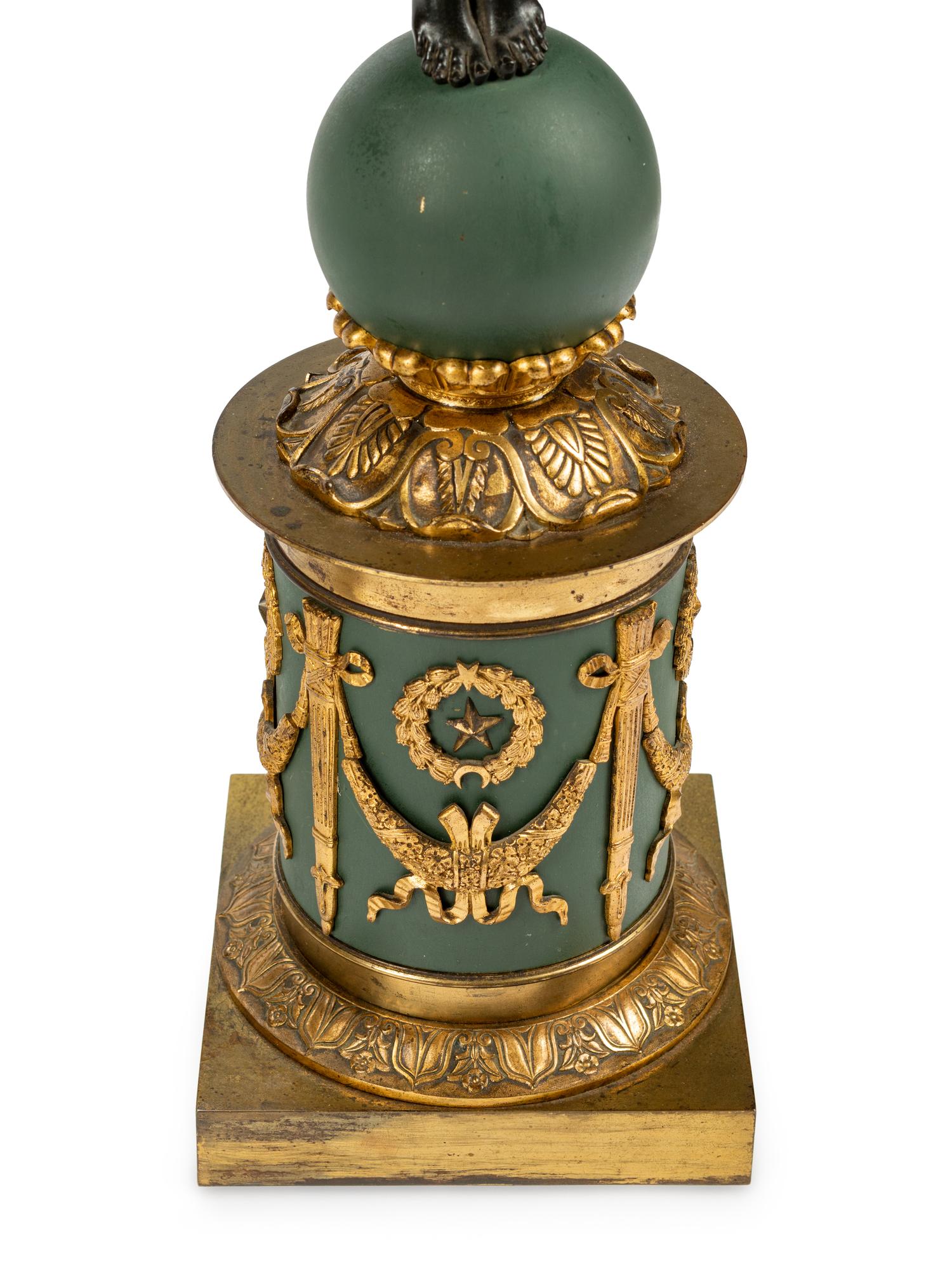 A Pair of Empire Style Gilt and Patinated Bronze and Tôle Six-Light Candelabra
