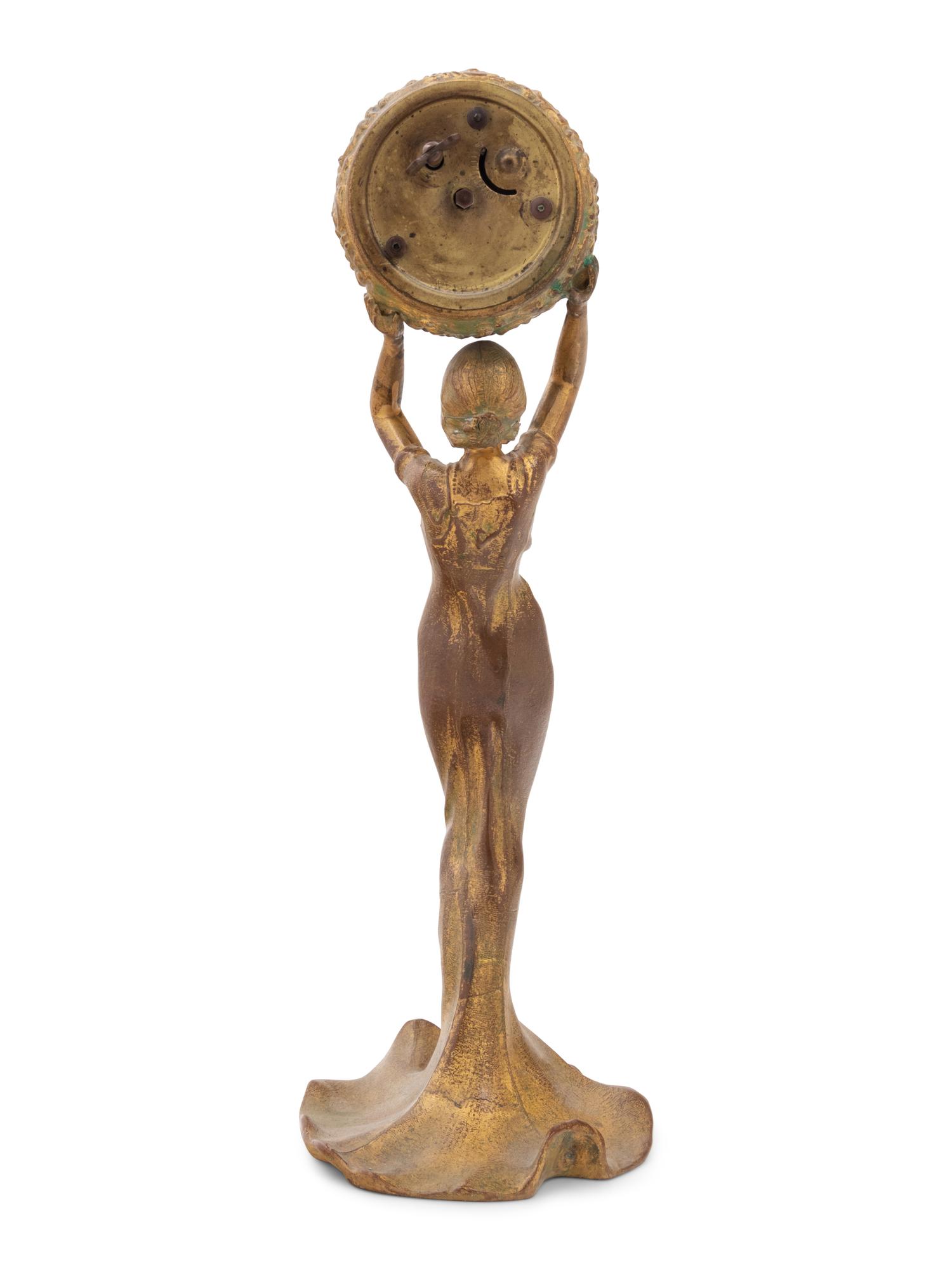 A New Haven Clock Co. Gilt Metal Figural Table Clock