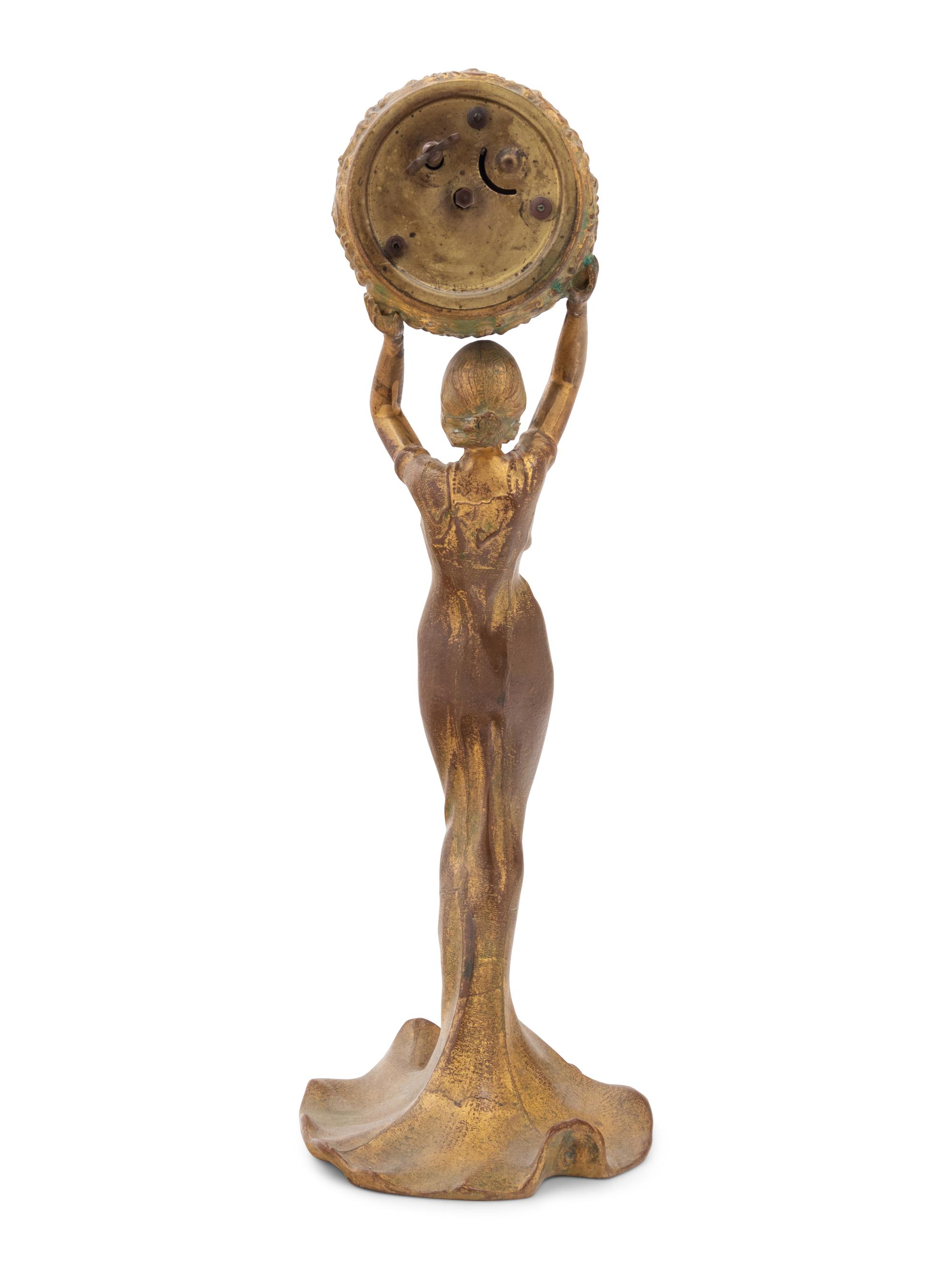 A New Haven Clock Co. Gilt Metal Figural Table Clock