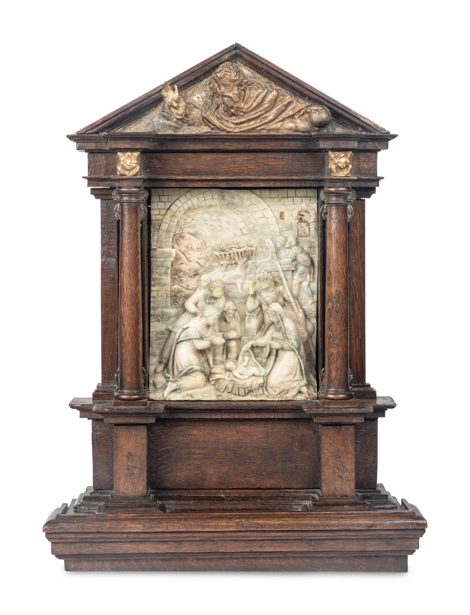 A Carved Stone Relief Panel Set in a Carved Oak and Parcel Gilt Frame