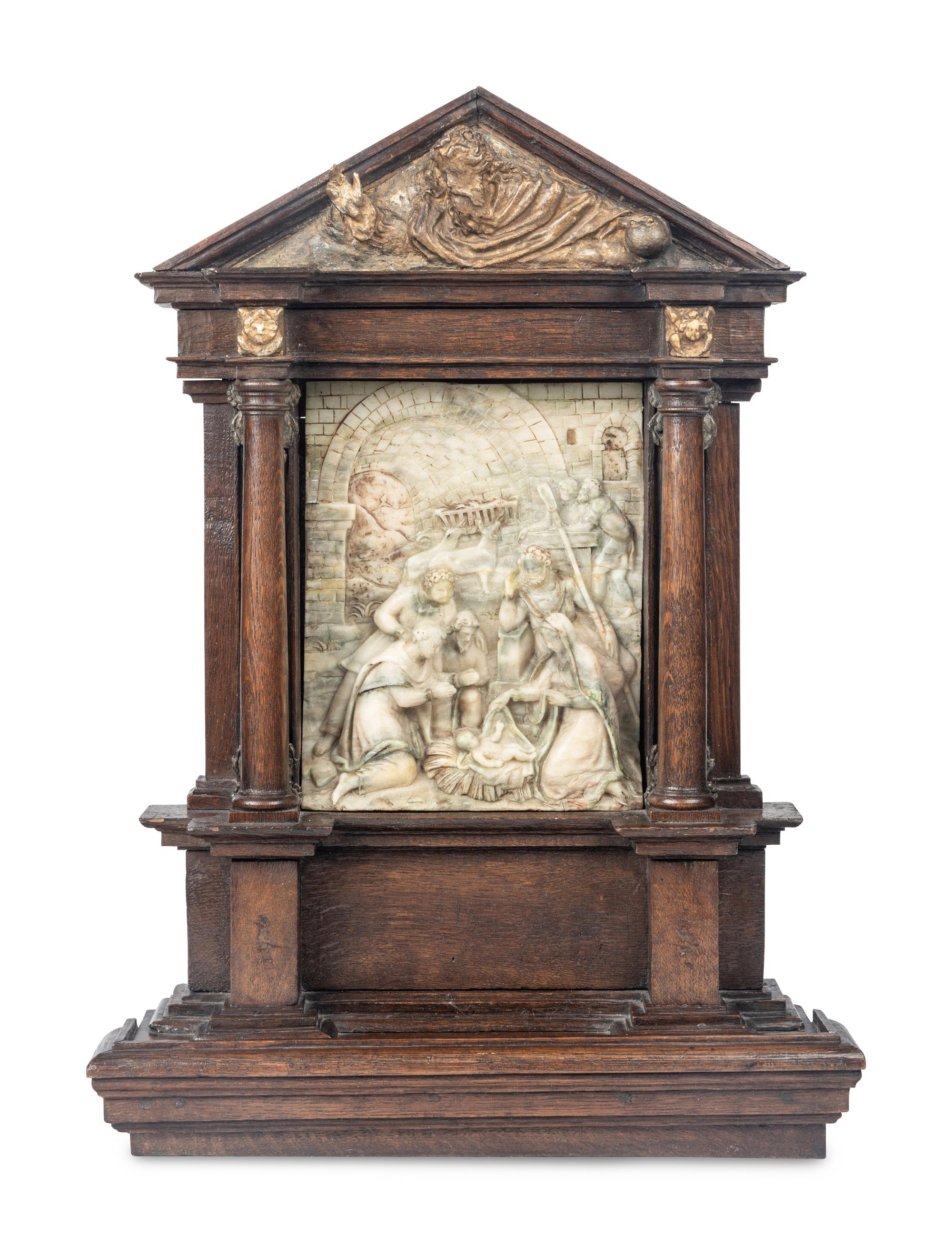 A Carved Stone Relief Panel Set in a Carved Oak and Parcel Gilt Frame