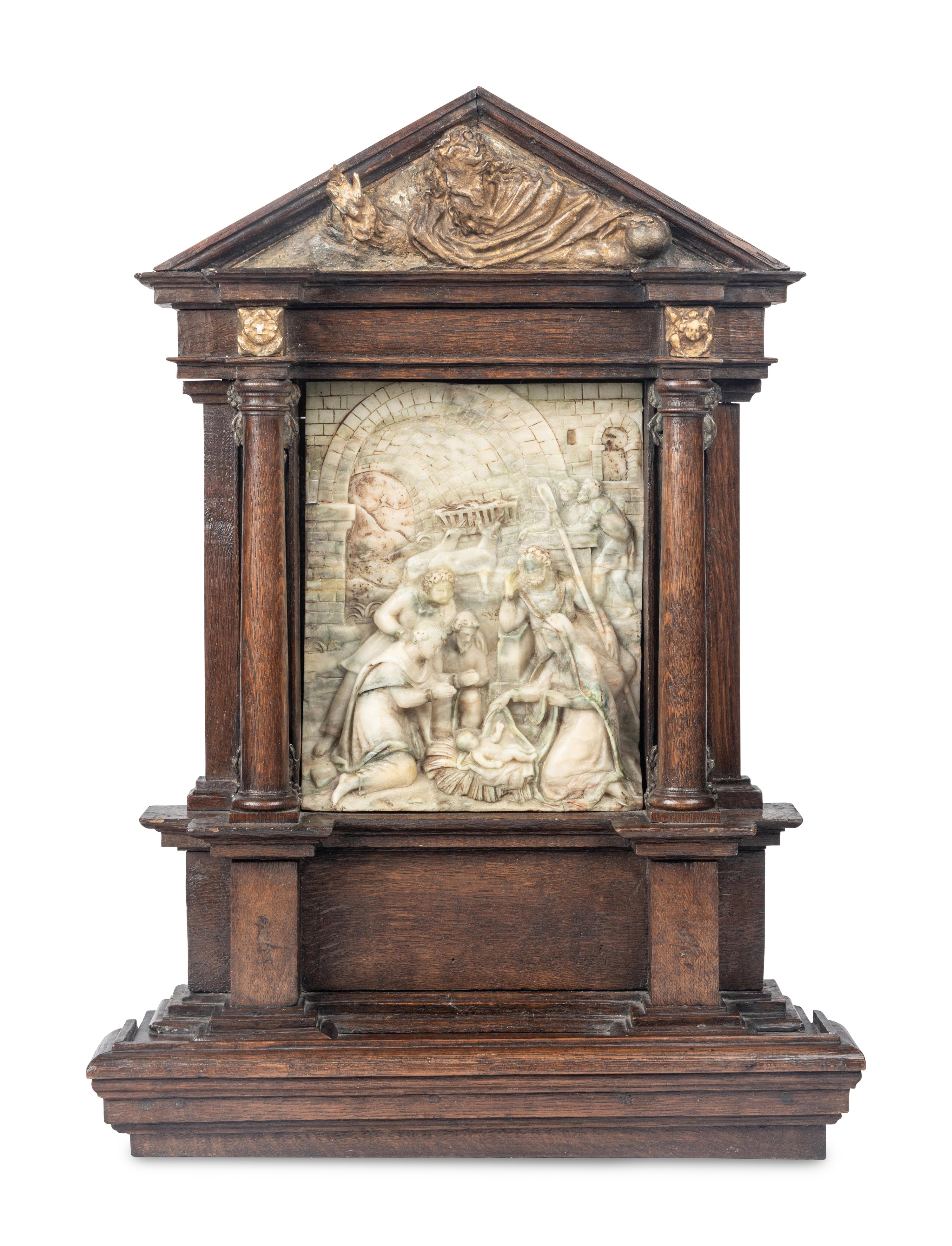A Carved Stone Relief Panel Set in a Carved Oak and Parcel Gilt Frame