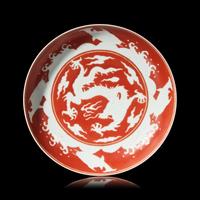 A Chinese Iron Red 'Dragon' Dish, 18th/19th Century 清中期 礬紅彩剔刻龍紋盤