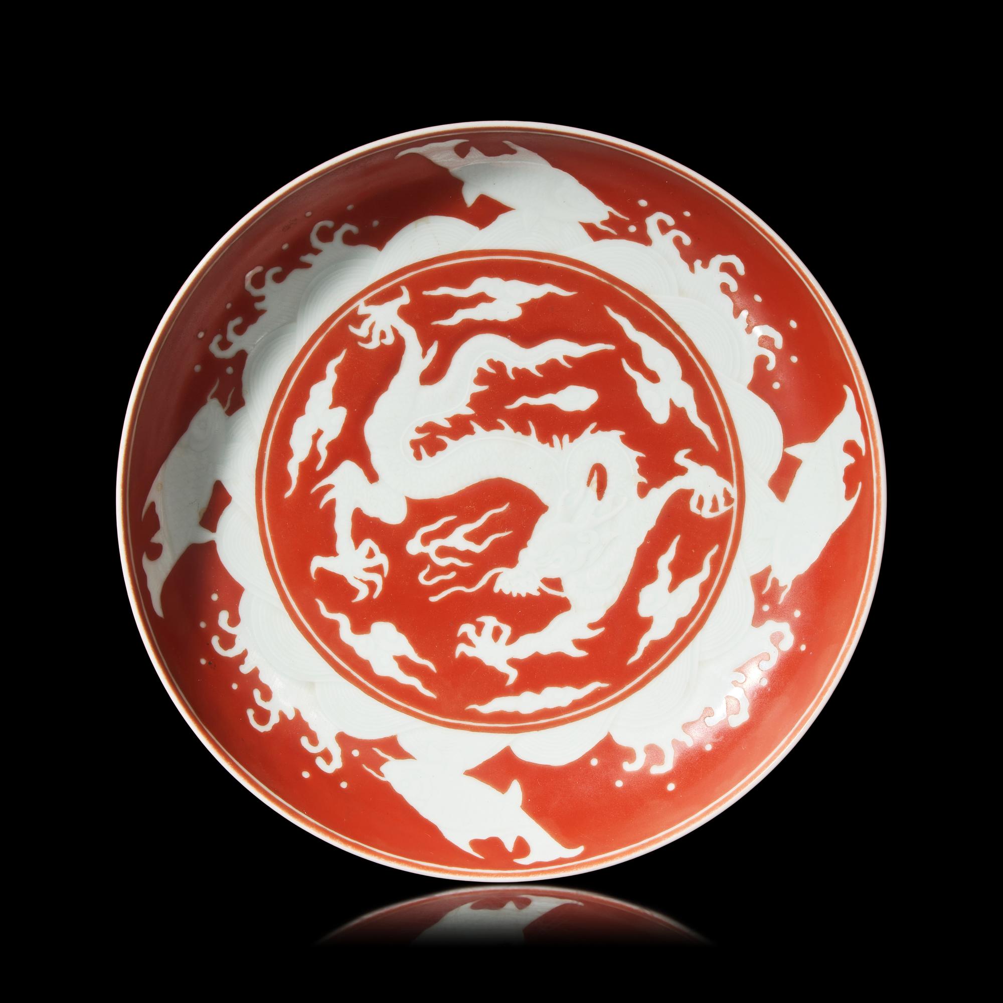 A Chinese Iron Red 'Dragon' Dish, 18th/19th Century 清中期 礬紅彩剔刻龍紋盤