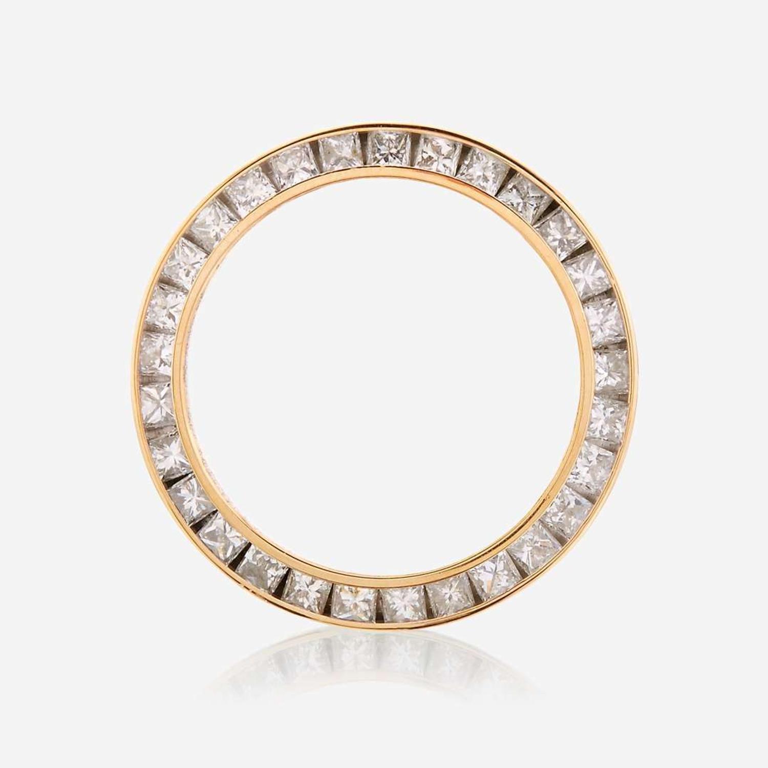 An eighteen karat gold and diamond watch bezel