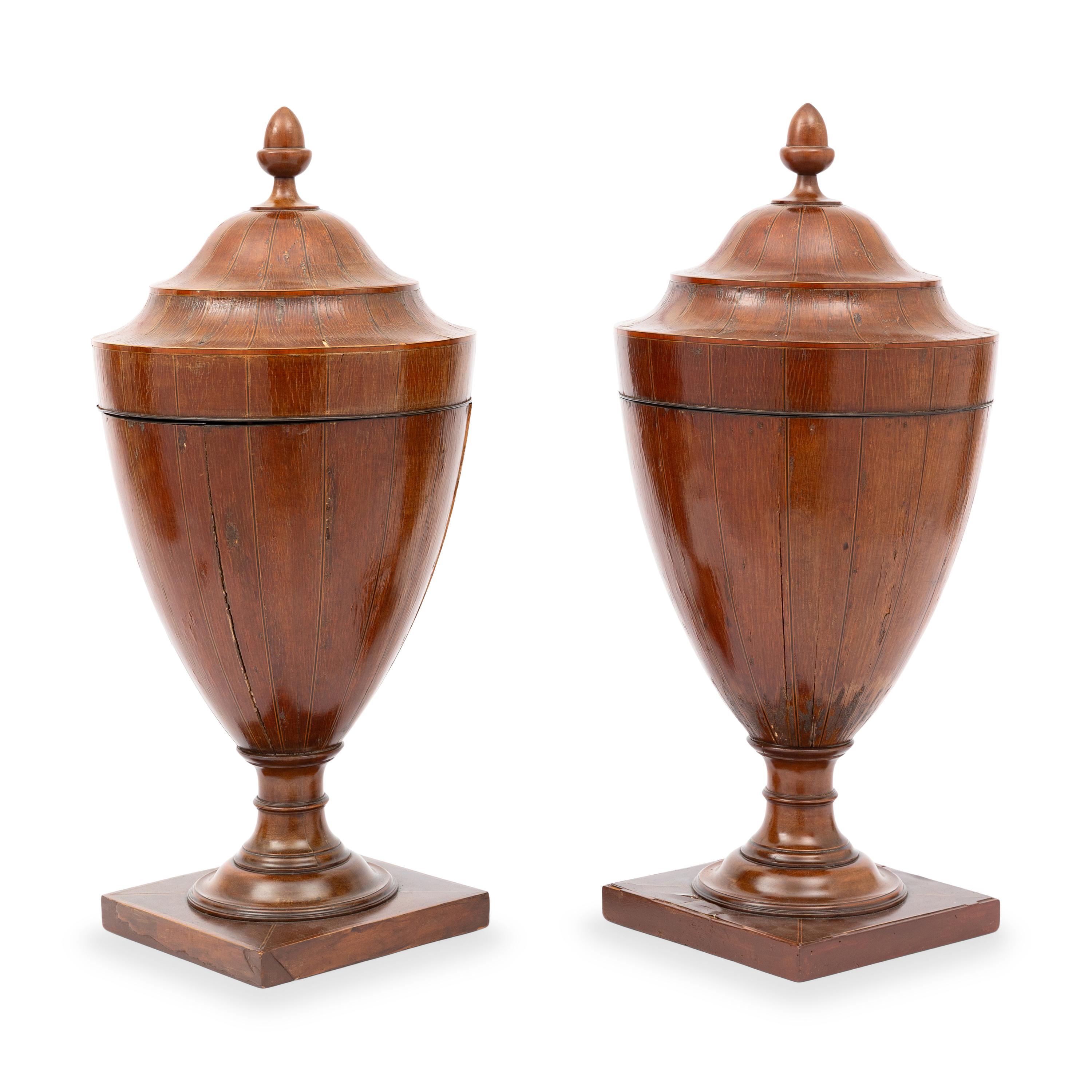 A Pair of George III Mahogany Urns