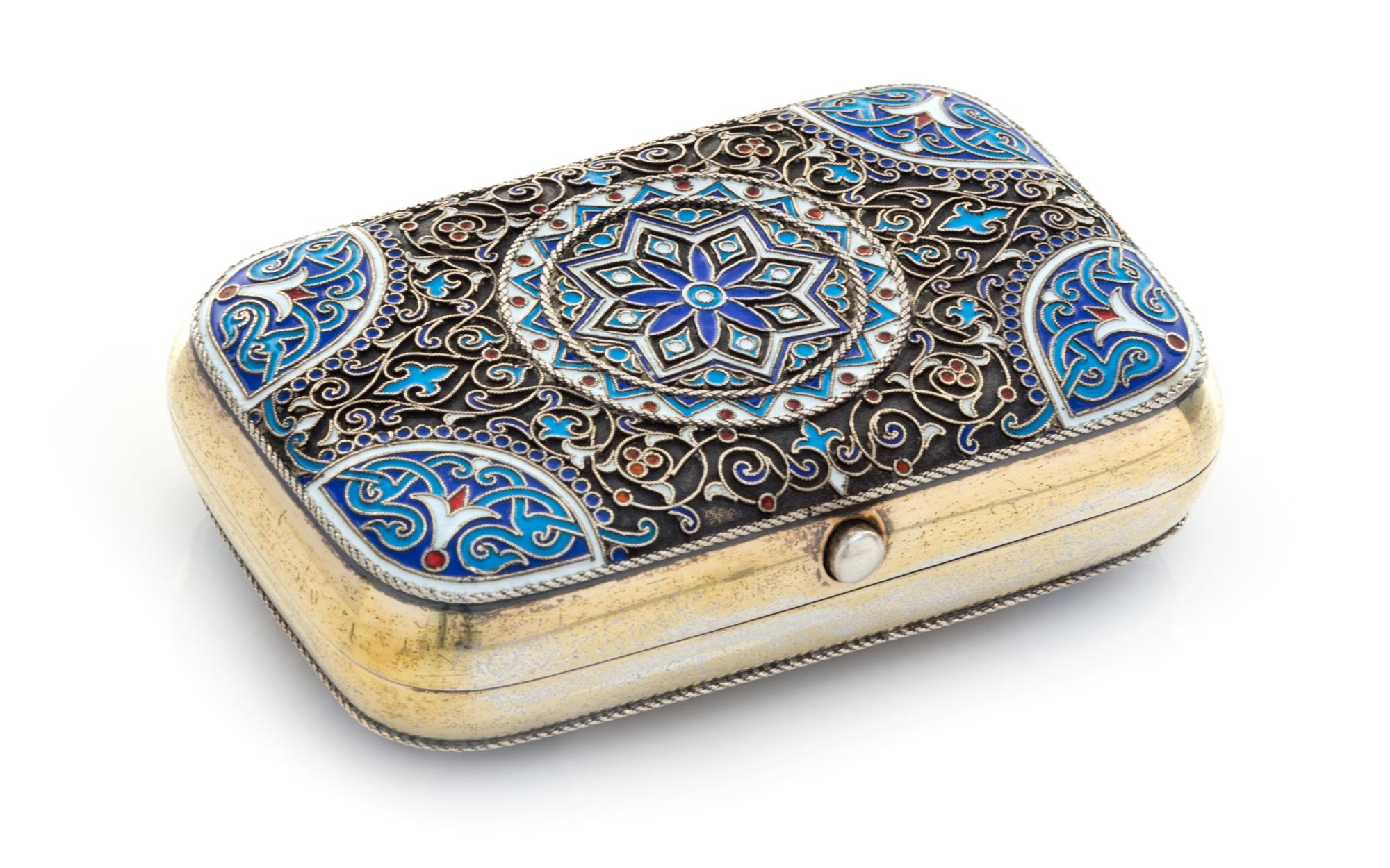 A Russian Enameled Silver Cigarette Case, Mark of Ivan Khlebnikov with imperial warrant, Moscow, 1882, the case worked with foliate and
