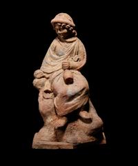 A Greek Terracotta Seated Scholar Holding a Wine Jug
