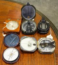 A Collection of Hand-Held Field Compasses — 19TH CENTURY AND LATER