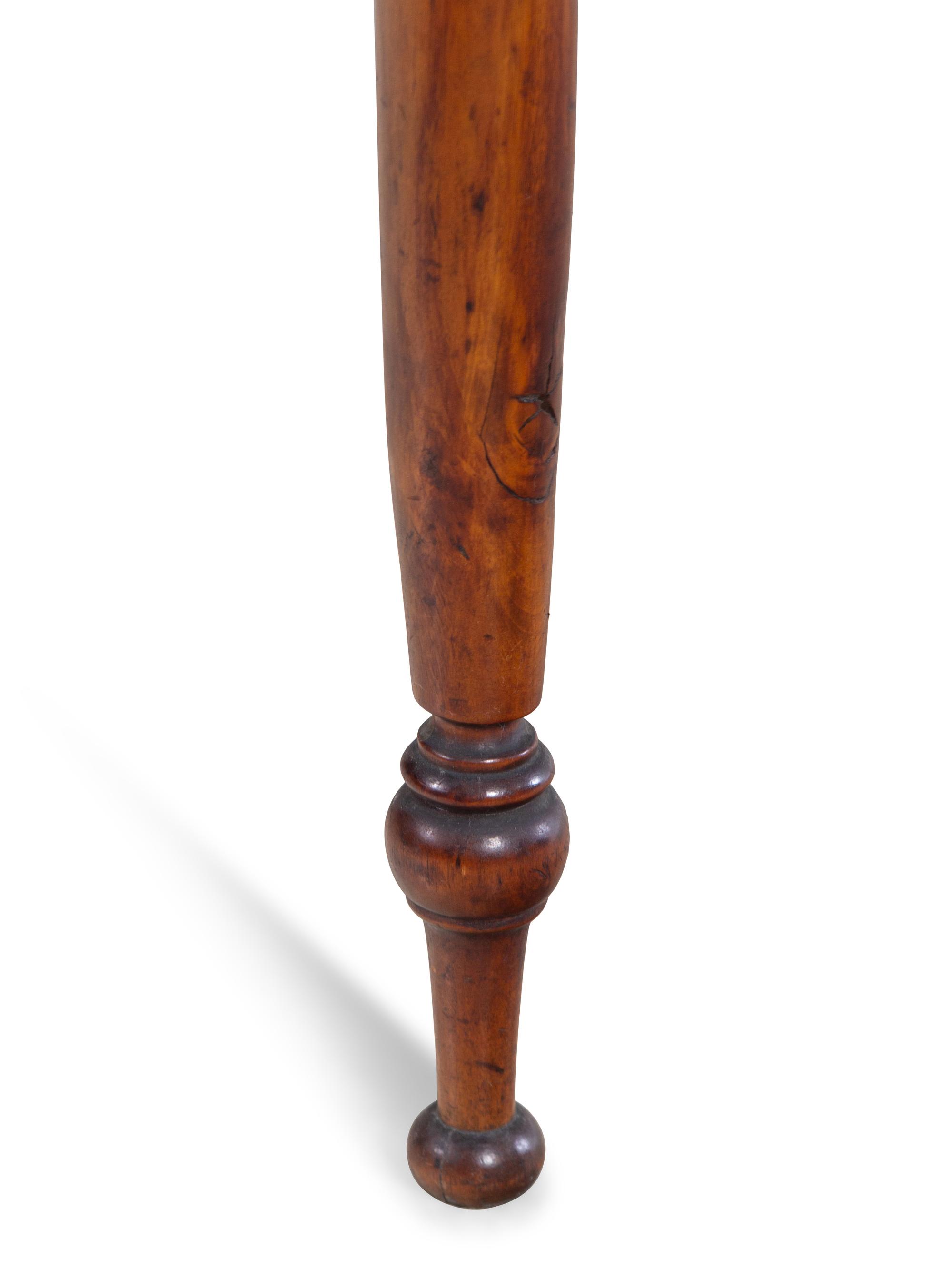 A Late Federal Cherrywood and Maple Drop Leaf Table