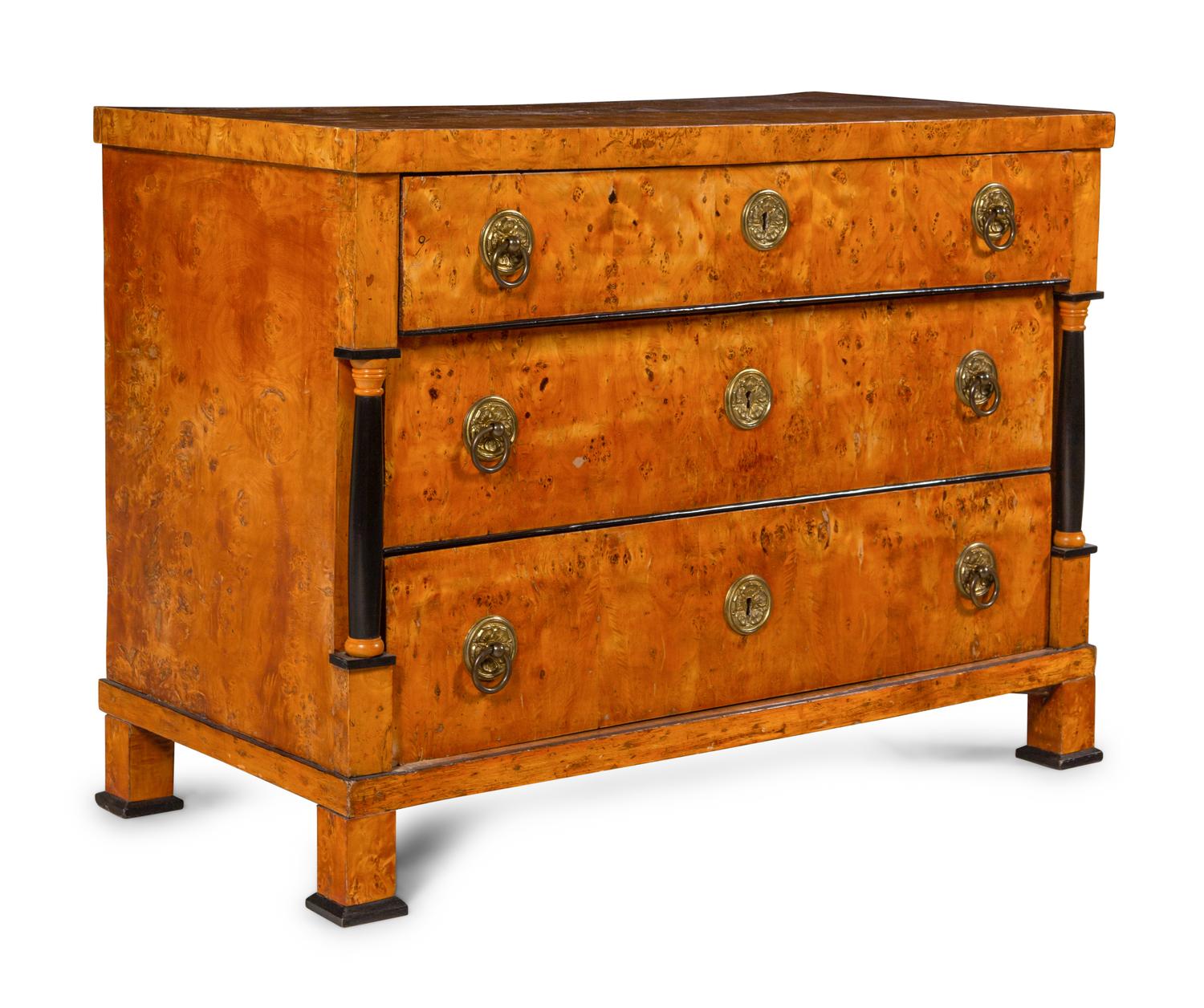 An Austrian or Northern European Parcel Ebonized Burlwood Commode