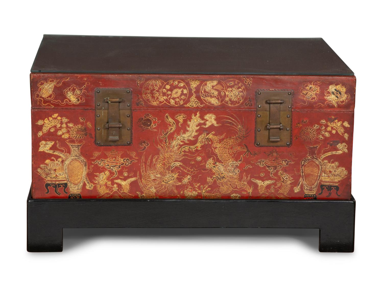 A Chinese Gilt-Decorated Red Leather Trunk on Black Lacquered Stand