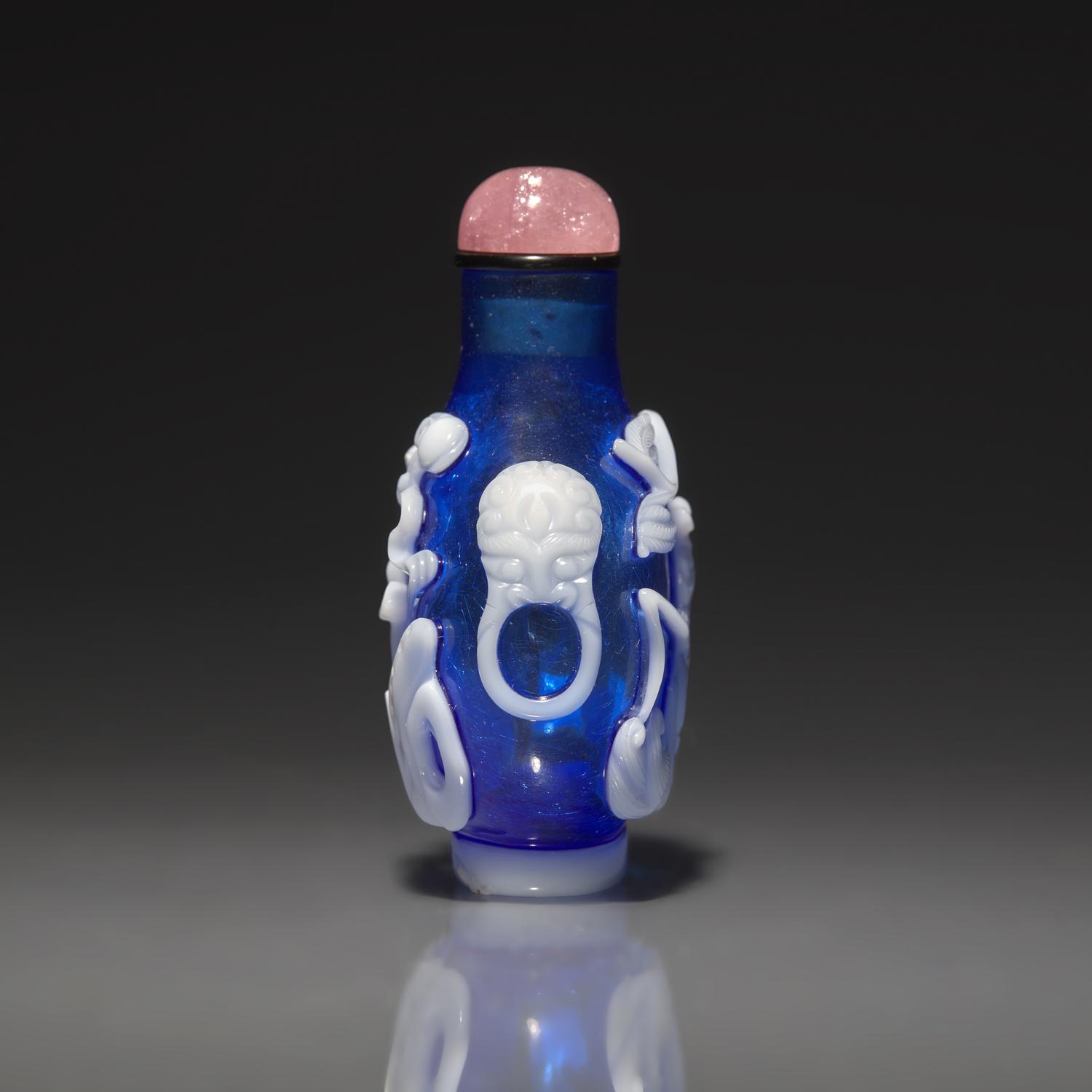 A Chinese White Overlay Blue Glass Snuff Bottle, Qing Dynasty, Possibly 18th-Early 19th Century 清中期 寶石藍地套涅白料垂釣圖鼻烟壺