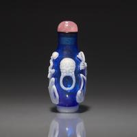A Chinese White Overlay Blue Glass Snuff Bottle, Qing Dynasty, Possibly 18th-Early 19th Century 清中期 寶石藍地套涅白料垂釣圖鼻烟壺
