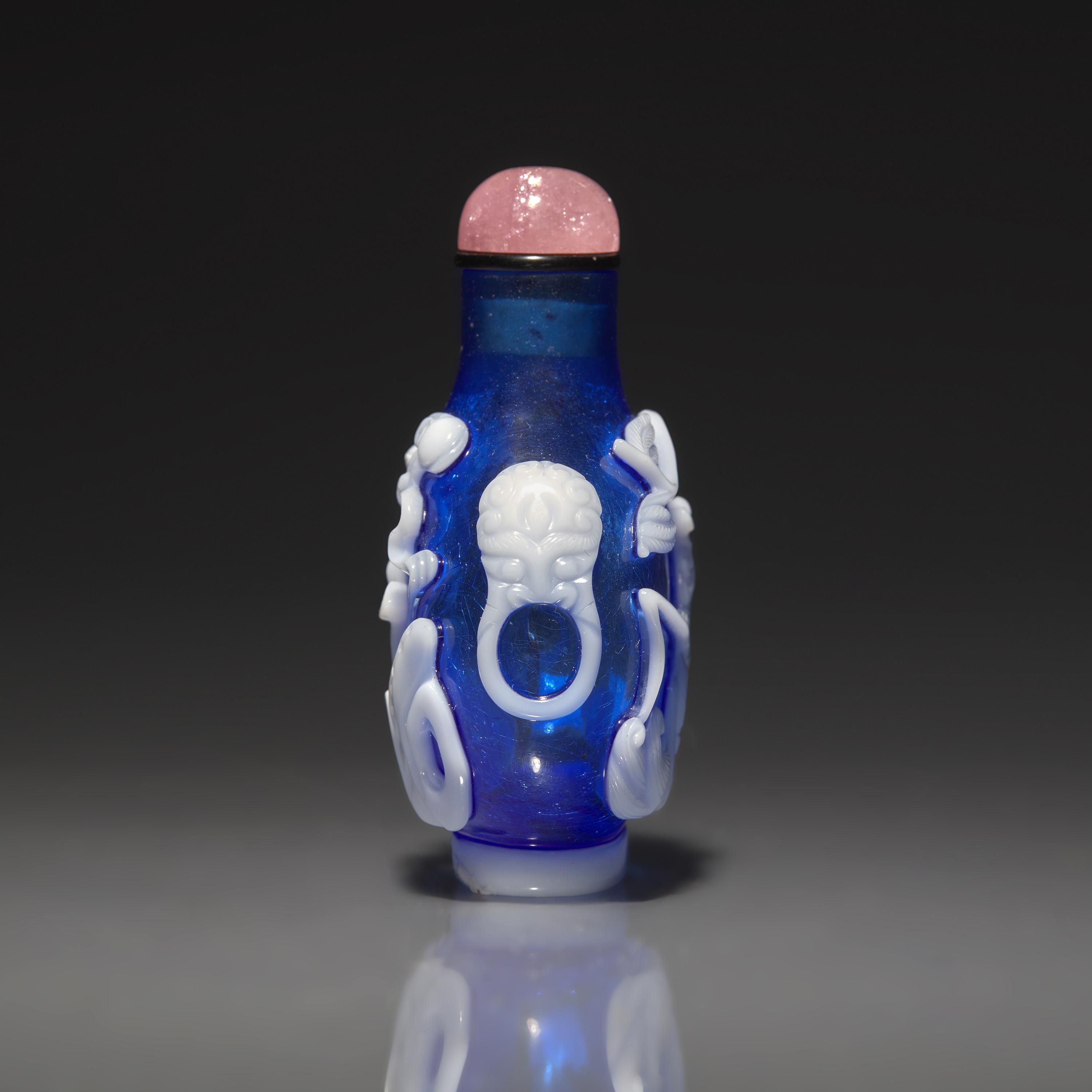 A Chinese White Overlay Blue Glass Snuff Bottle, Qing Dynasty, Possibly 18th-Early 19th Century 清中期 寶石藍地套涅白料垂釣圖鼻烟壺