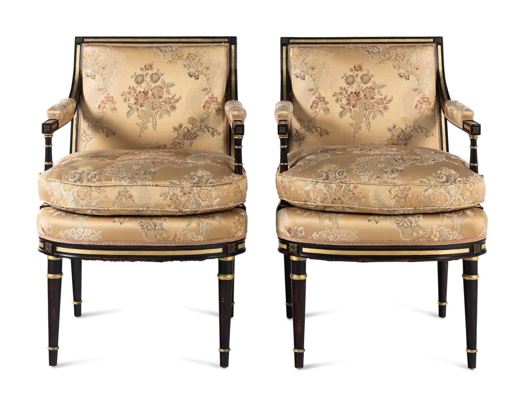 A Pair of Regency Style Painted and Parcel Gilt Armchairs